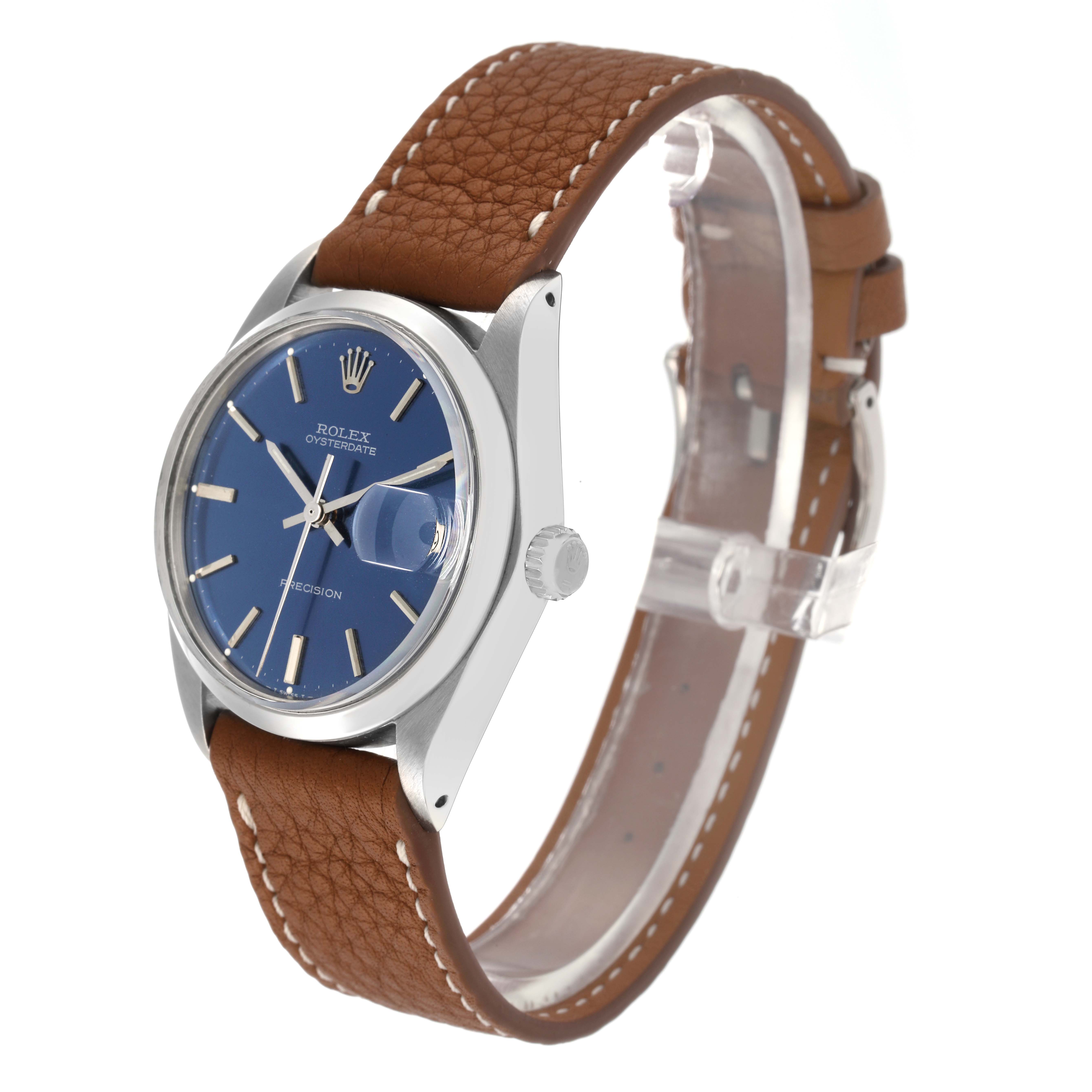 The Rolex Vintage Collection 6694 Men
s Stainless Steel Blue Dial 6694 Men
s Stainless Steel Blue Dial watch is shown at a three-quarter angle, displaying the face, bezel, crown, and brown leather strap.