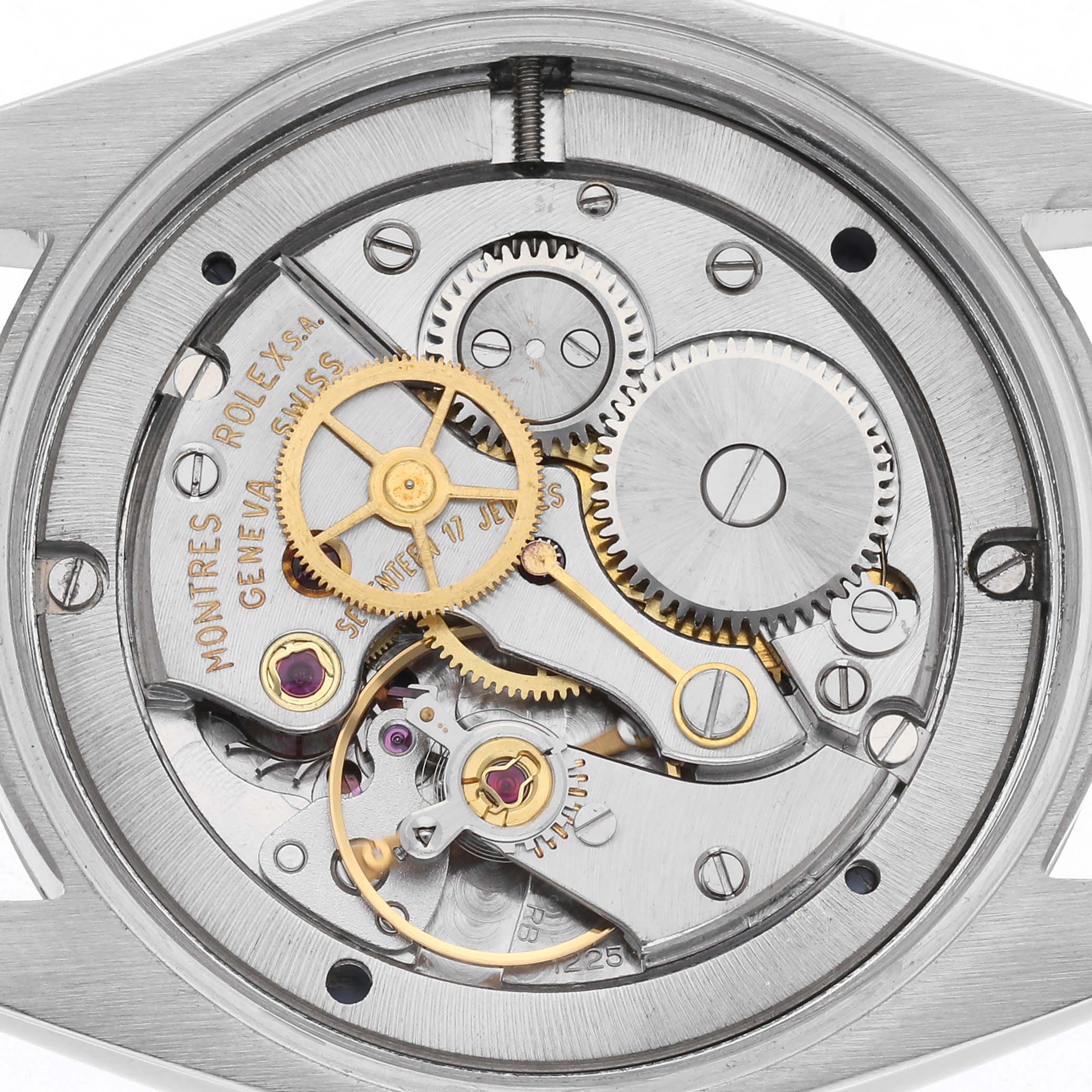 The image shows the inner mechanics of a Rolex Vintage Collection 6694 Men
s Stainless Steel Blue Dial 6694 Men
s Stainless Steel Blue Dial watch, highlighting cogs and gears.