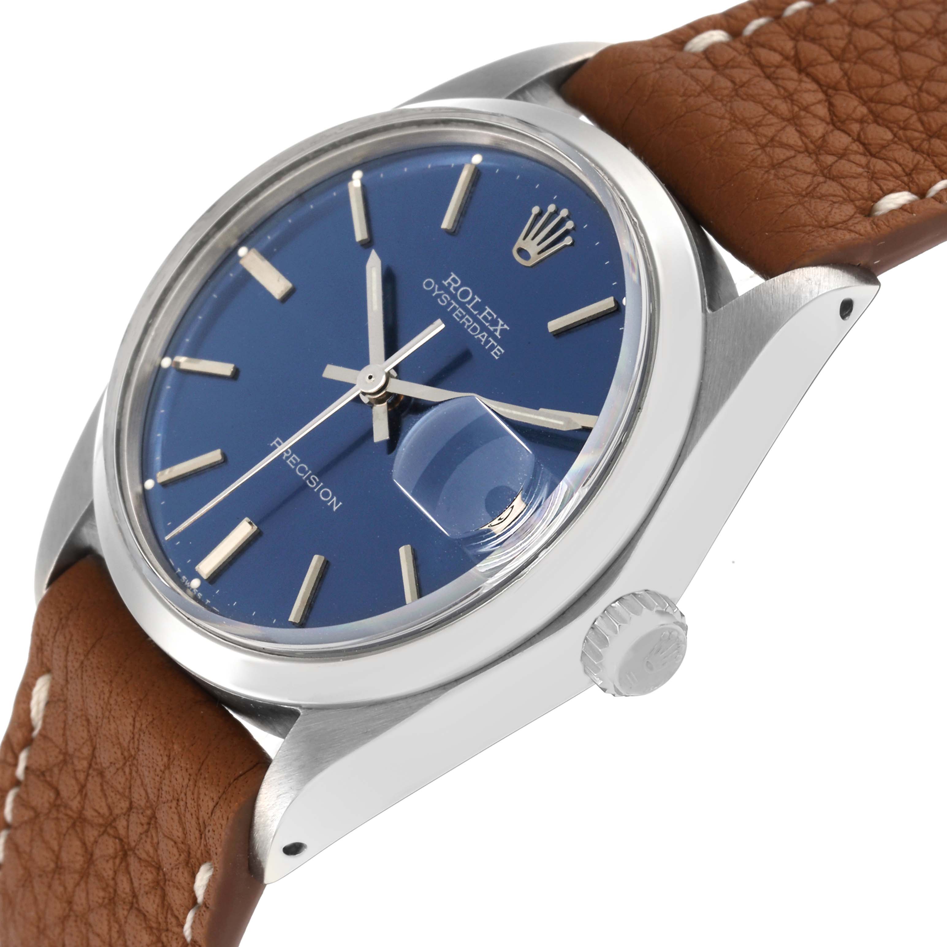 The Rolex Vintage Collection 6694 Men
s Stainless Steel Blue Dial 6694 Men
s Stainless Steel Blue Dial watch is shown at an angled view highlighting the blue dial, crown, case, and brown leather strap.