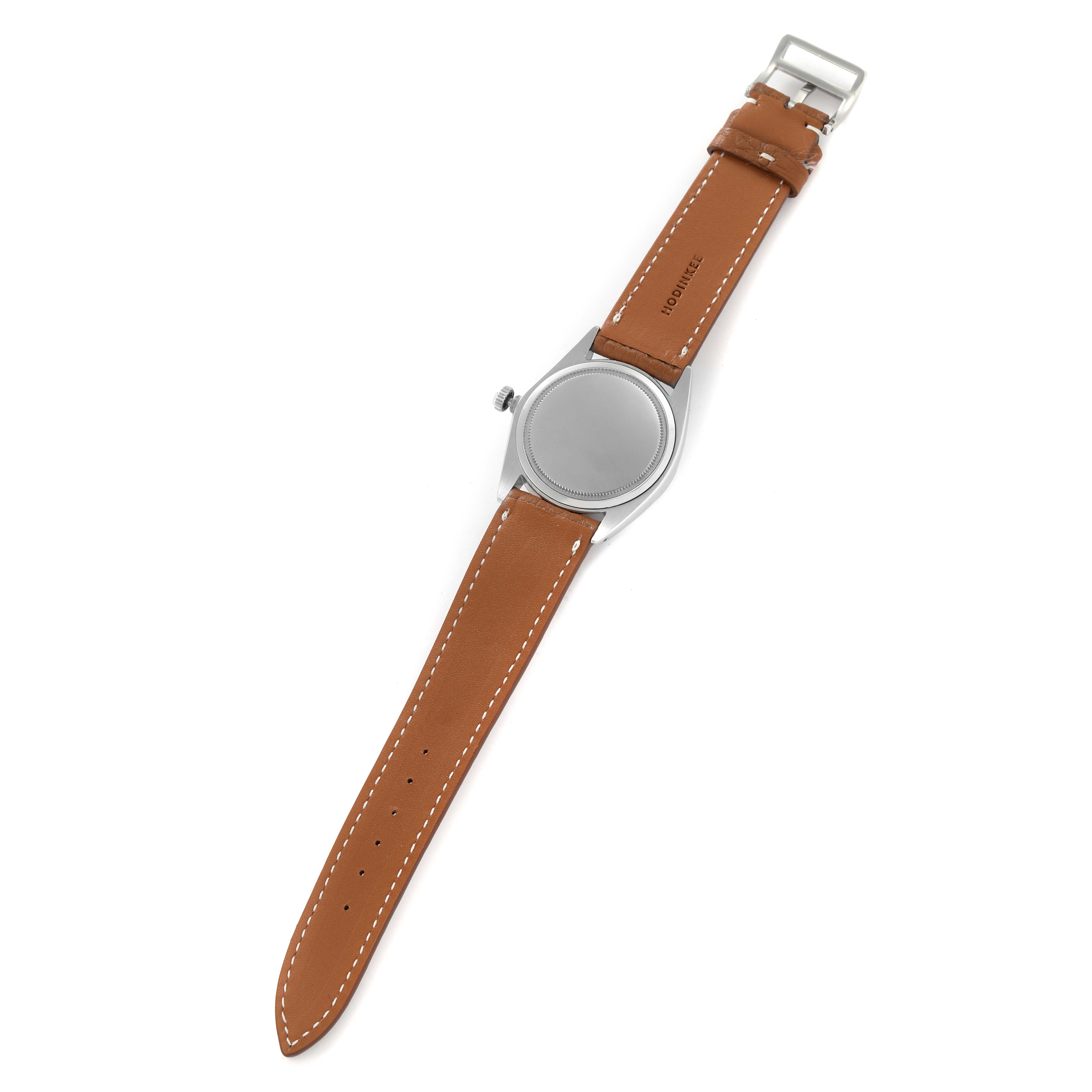 The Rolex Vintage Collection 6694 Men
s Stainless Steel Blue Dial 6694 Men
s Stainless Steel Blue Dial watch is shown from the back, featuring a brown leather strap and stainless steel case.