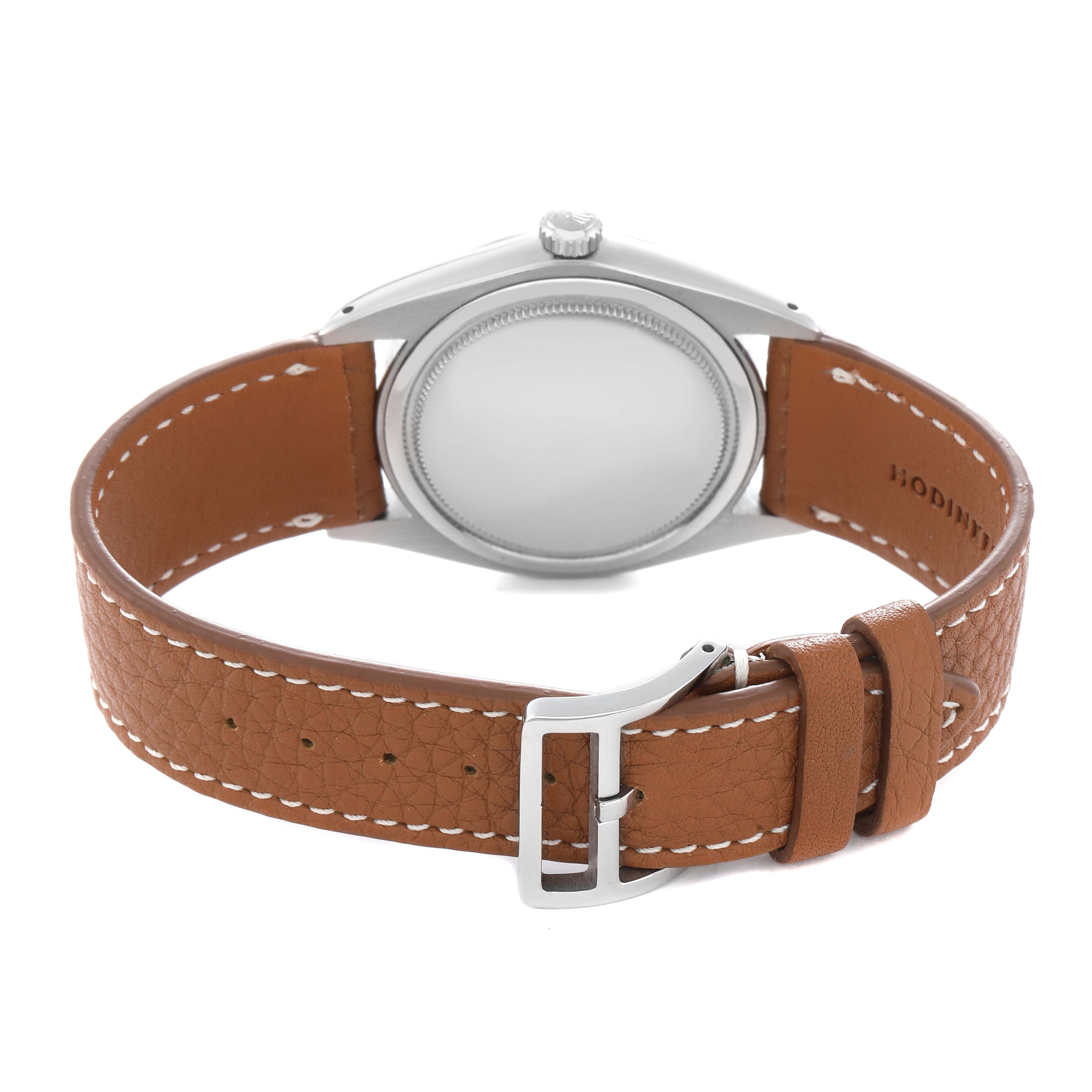 The Rolex Vintage Collection 6694 Men
s Stainless Steel Blue Dial 6694 Men
s Stainless Steel Blue Dial watch is shown from the back, highlighting the case back and brown leather strap with a buckle.