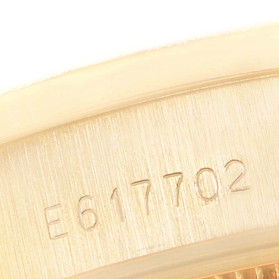 This close-up image shows the serial number engraving on the gold case side of a Rolex President 69288 Women
s Yellow Gold Champagne Dial 69288 Women
s Yellow Gold Champagne Dial model watch.