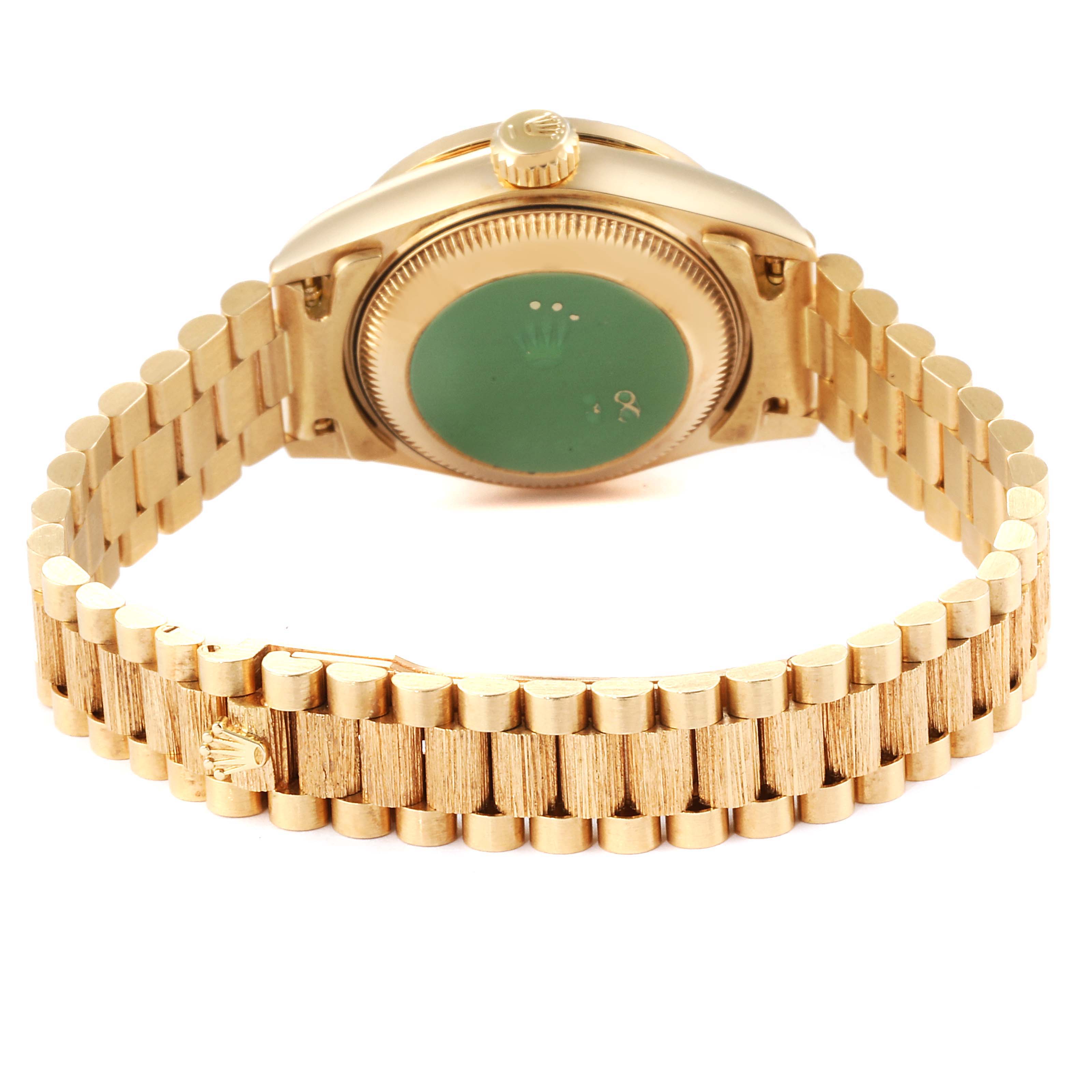 The image shows the back view of a Rolex President 69288 Women
s Yellow Gold Champagne Dial 69288 Women
s Yellow Gold Champagne Dial model watch, highlighting its case back and bracelet.