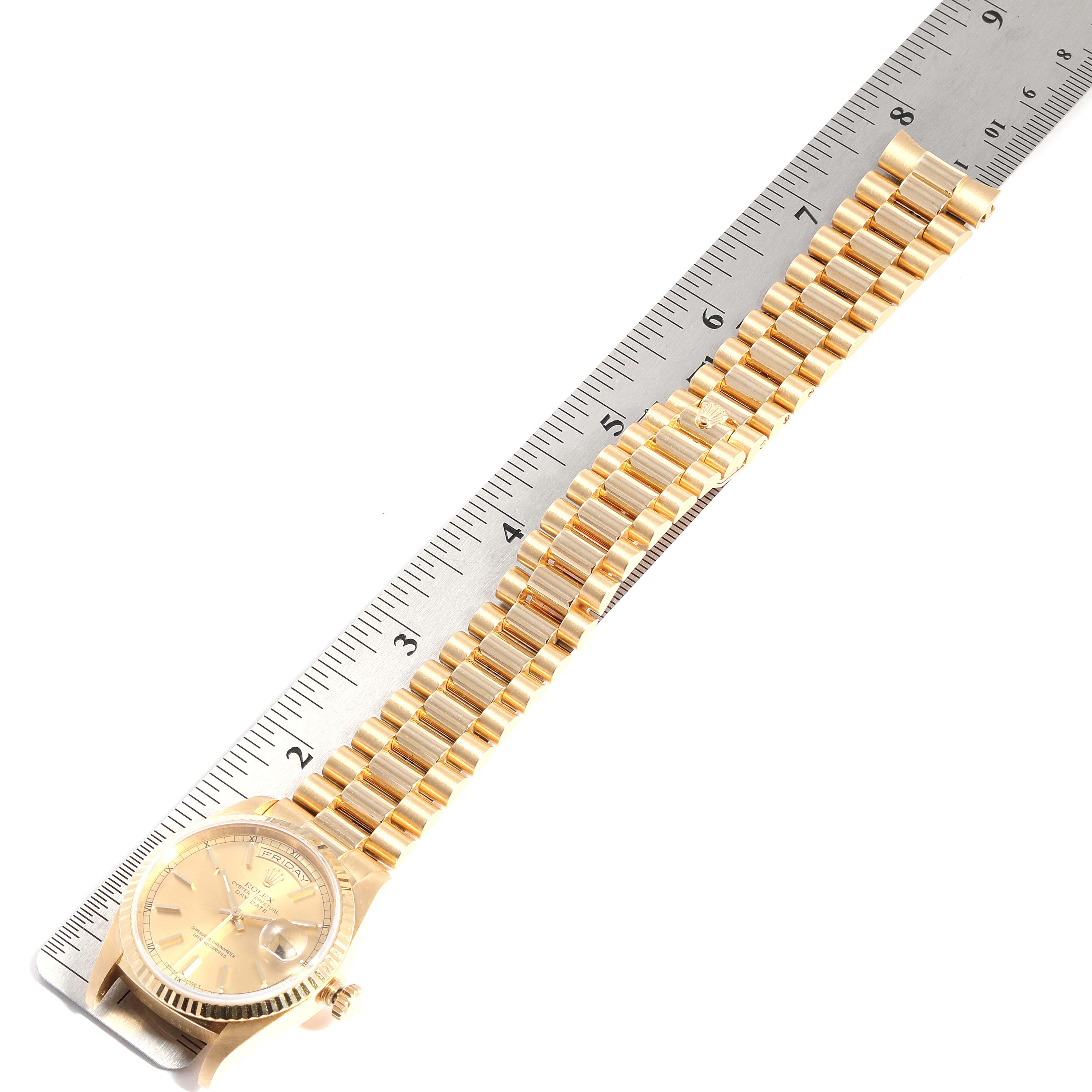 The image shows a gold Rolex President 18238 Men's Yellow Gold Champagne Dial 18238 Men's Yellow Gold Champagne Dial model watch laid flat with its bracelet and dial partially measured by a ruler.