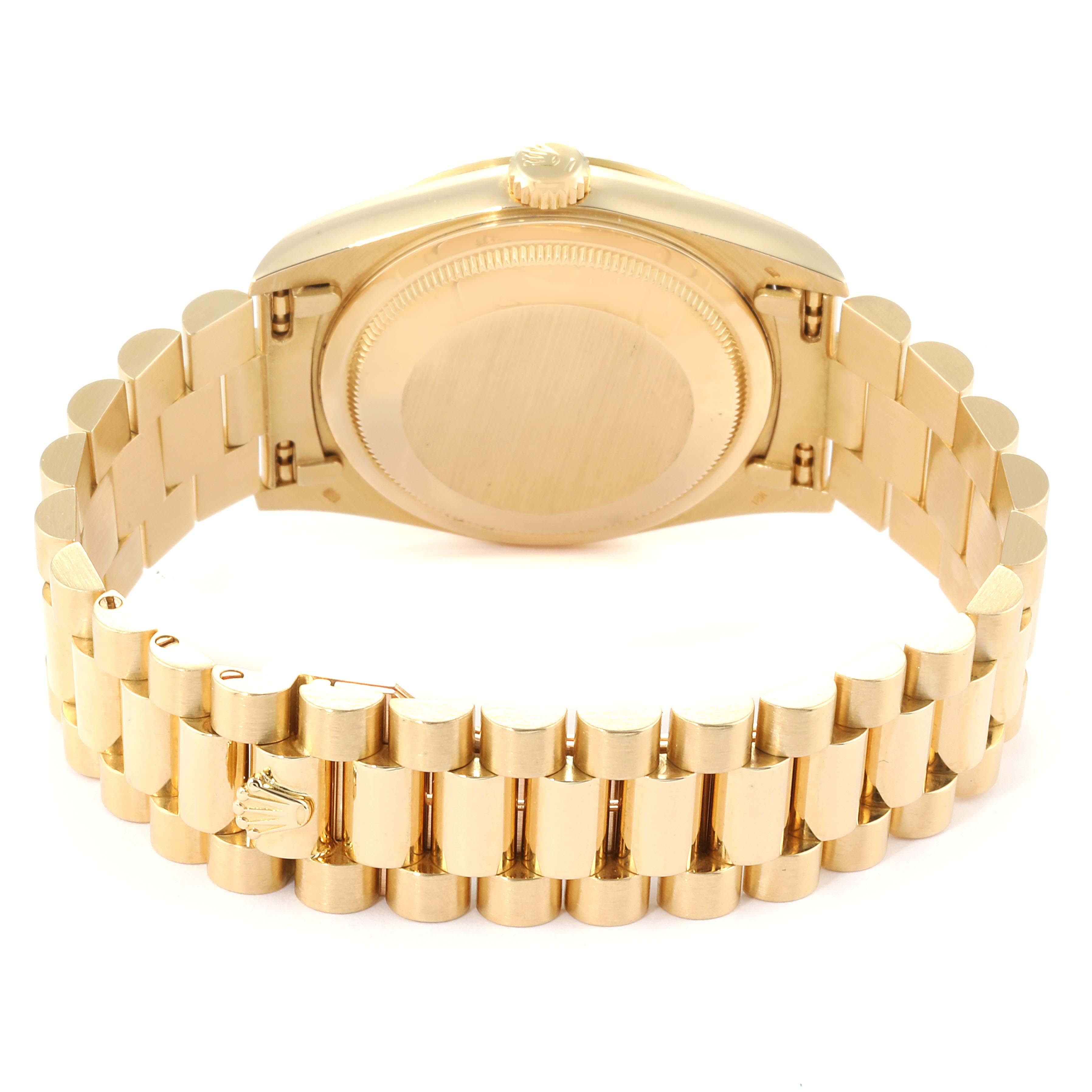 The image shows the backside view of a Rolex President 18238 Men's Yellow Gold Champagne Dial 18238 Men's Yellow Gold Champagne Dial model watch, highlighting the case back and a portion of the gold bracelet.