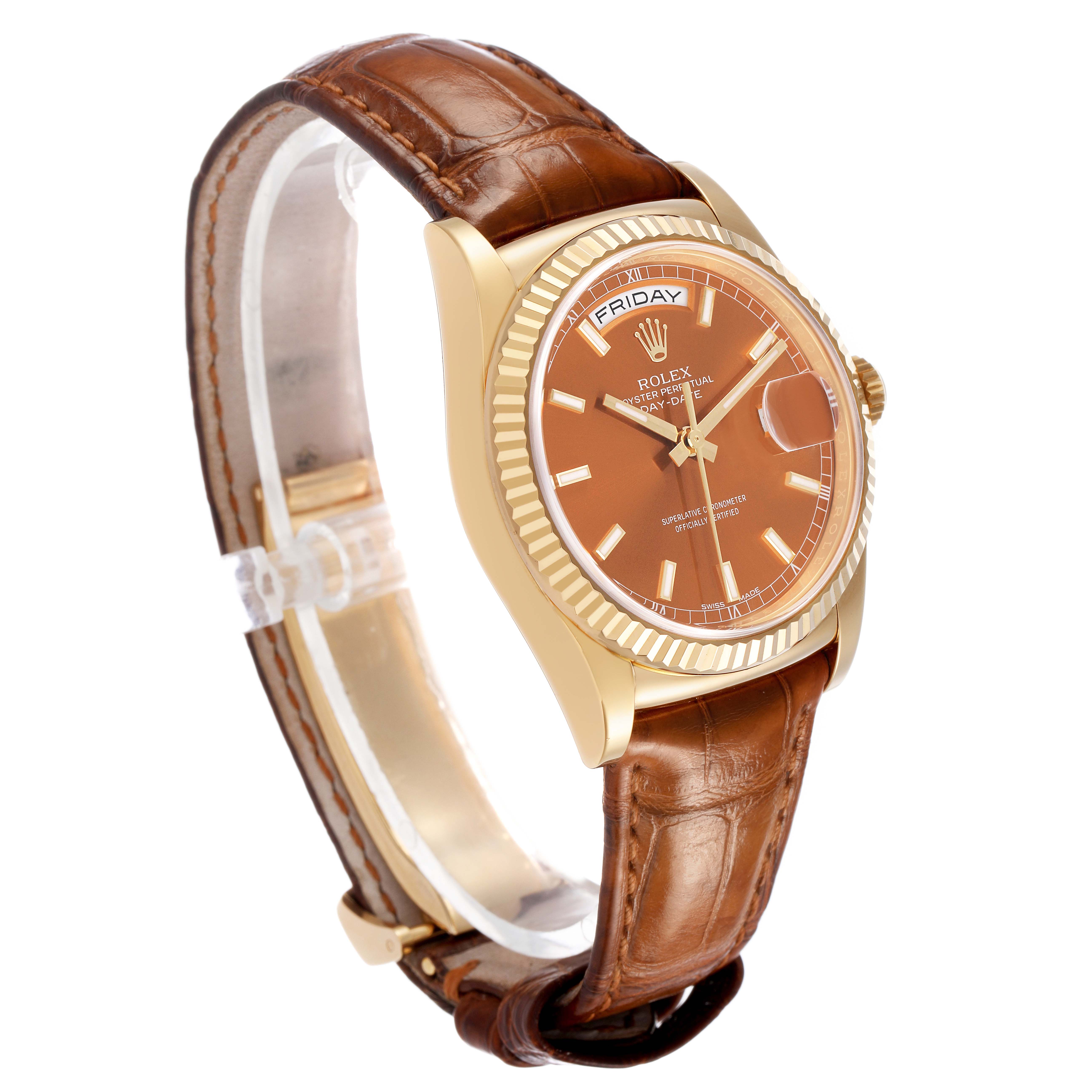 The Rolex President 118138 Men's Yellow Gold Orange Dial model watch is shown at a three-quarter angle, highlighting its face, bezel, and brown leather strap.