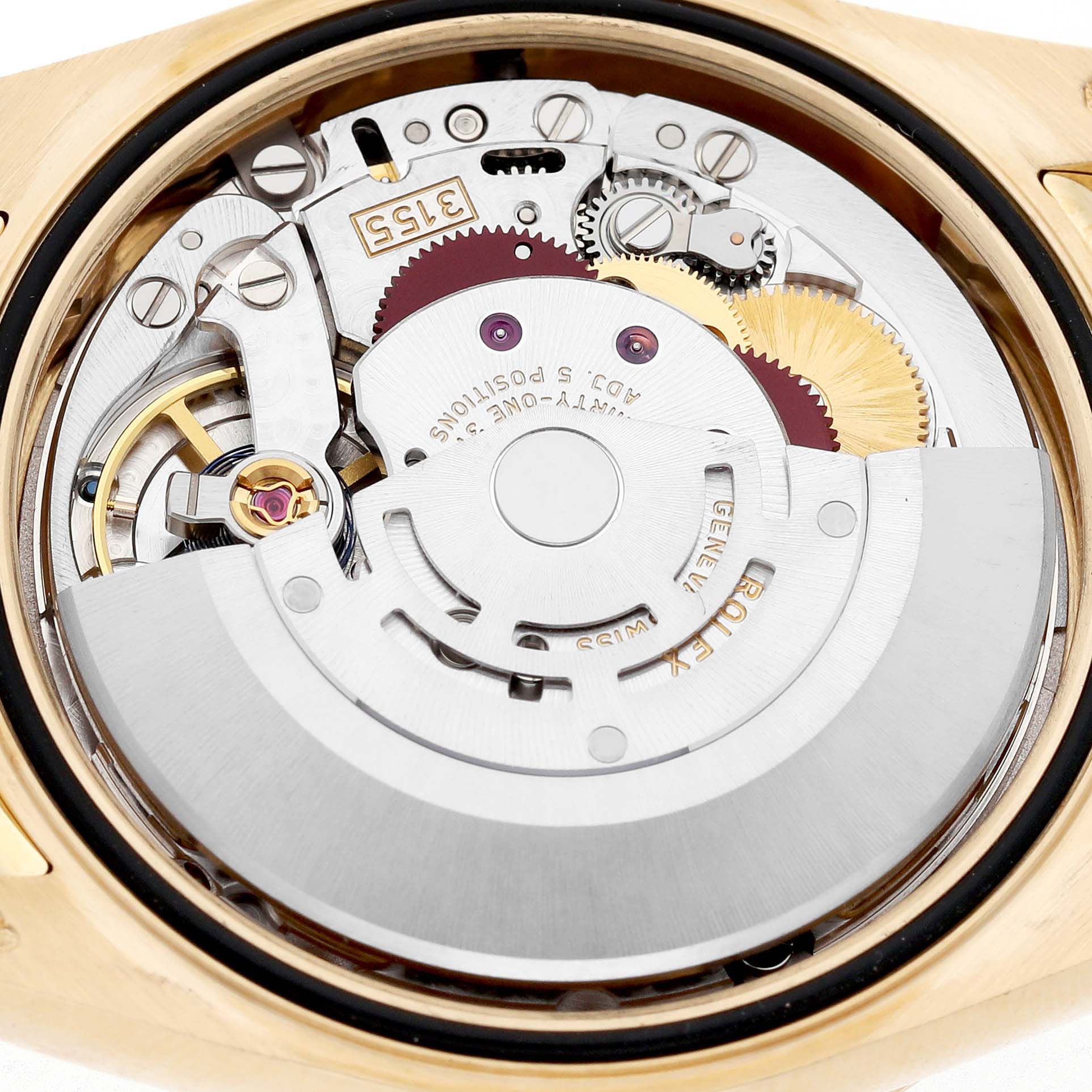 The image shows the movement mechanism of a Rolex President 118138 Men's Yellow Gold Orange Dial watch viewed from the back.