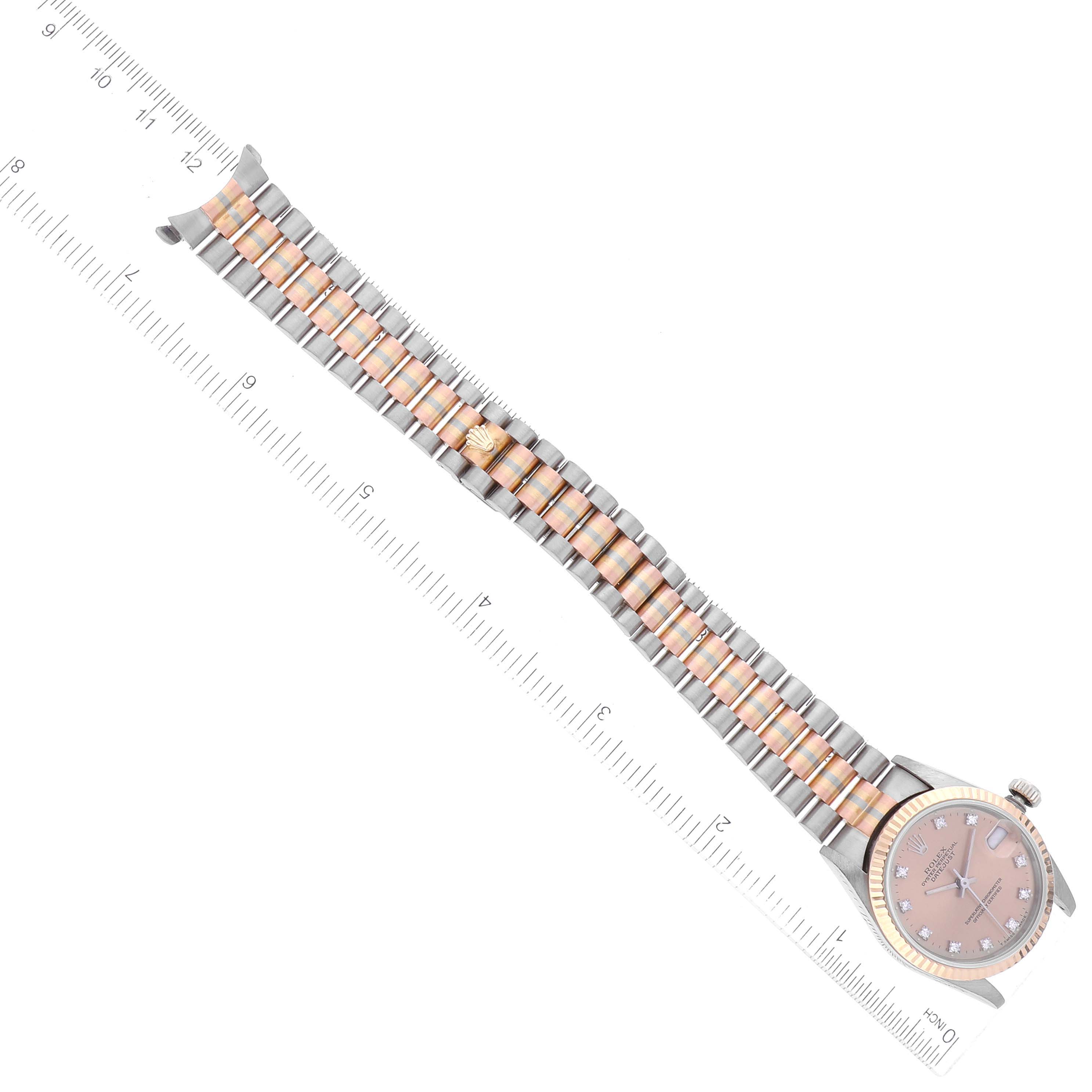 This image shows the Rolex President 68279 Women's White Gold Brown Dial 68279 Women's White Gold Brown Dial watch model from a top-down angle, displaying the face, bezel, and bracelet fully extended next to a ruler.