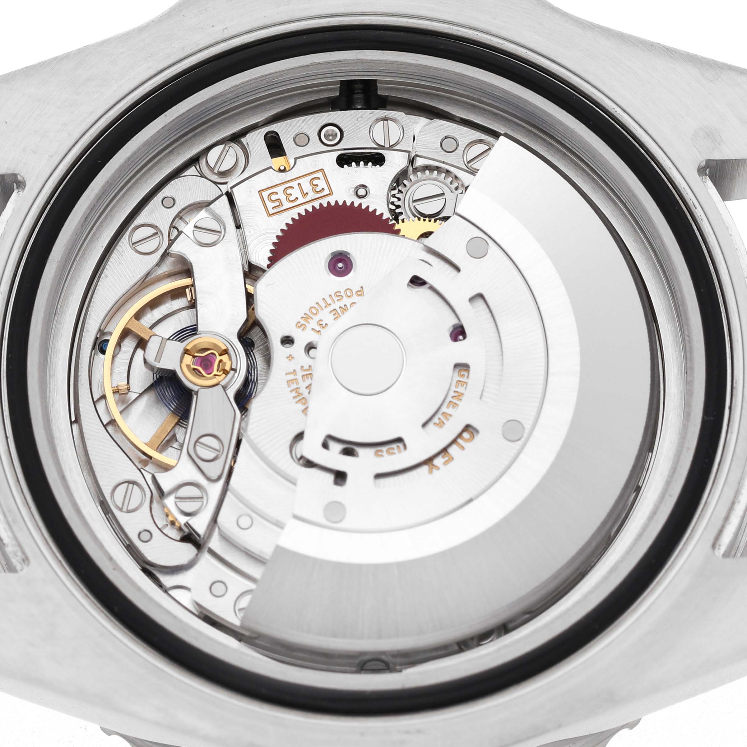The image shows the back view of a Rolex Sea-Dweller 116600 Men's Stainless Steel Black Dial watch, highlighting its intricate movement and internal mechanisms.