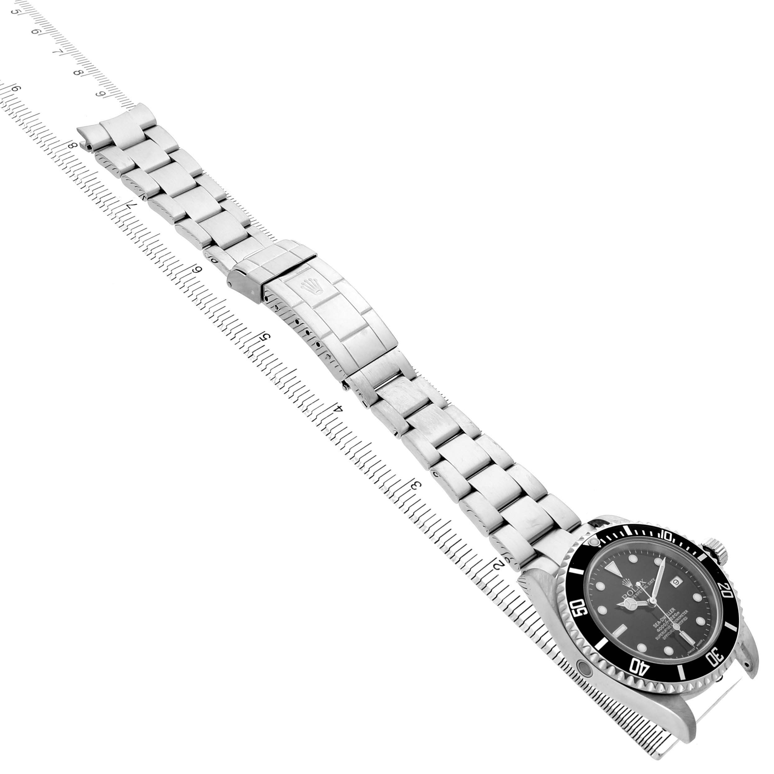 The Rolex Sea-Dweller 16600 Men's Stainless Steel Black Dial watch is shown from an angled side view, displaying the full bracelet, clasp, and bezel.
