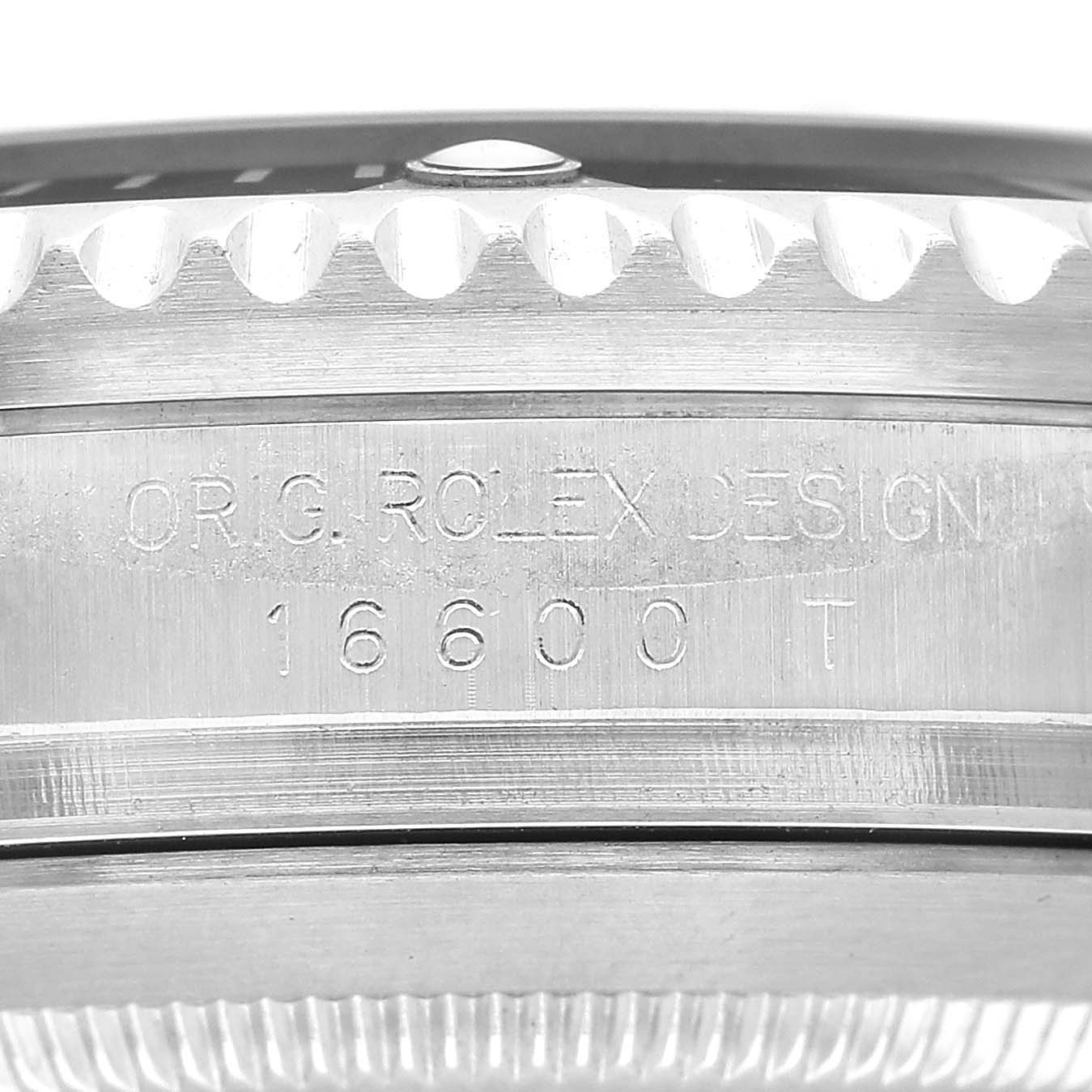 The image shows a close-up of the Rolex Sea-Dweller 16600 Men's Stainless Steel Black Dial's engraved case side with design details.