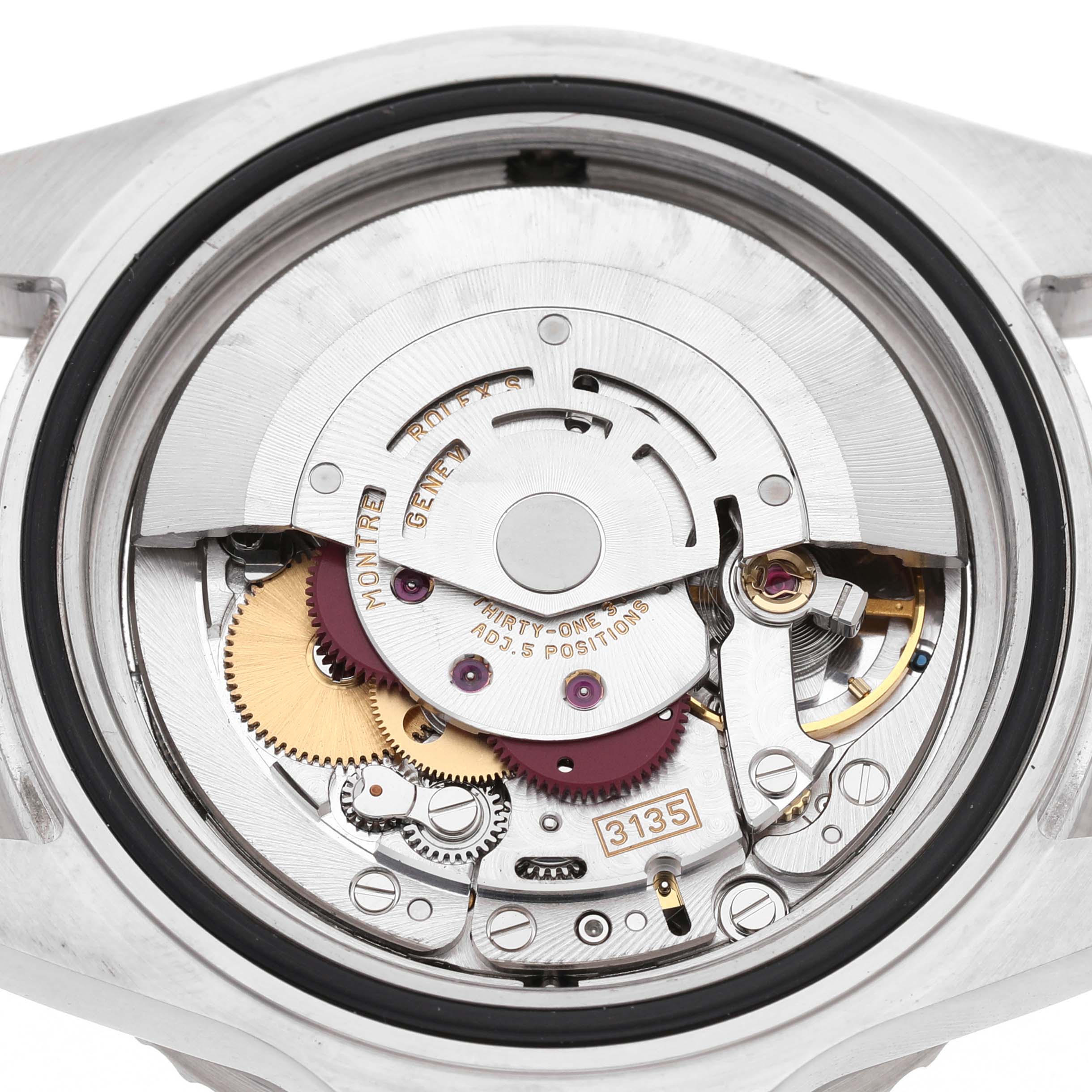 The image shows a close-up of the movement of a Rolex Sea-Dweller 16600 Men's Stainless Steel Black Dial watch, focusing on its intricate mechanical components.