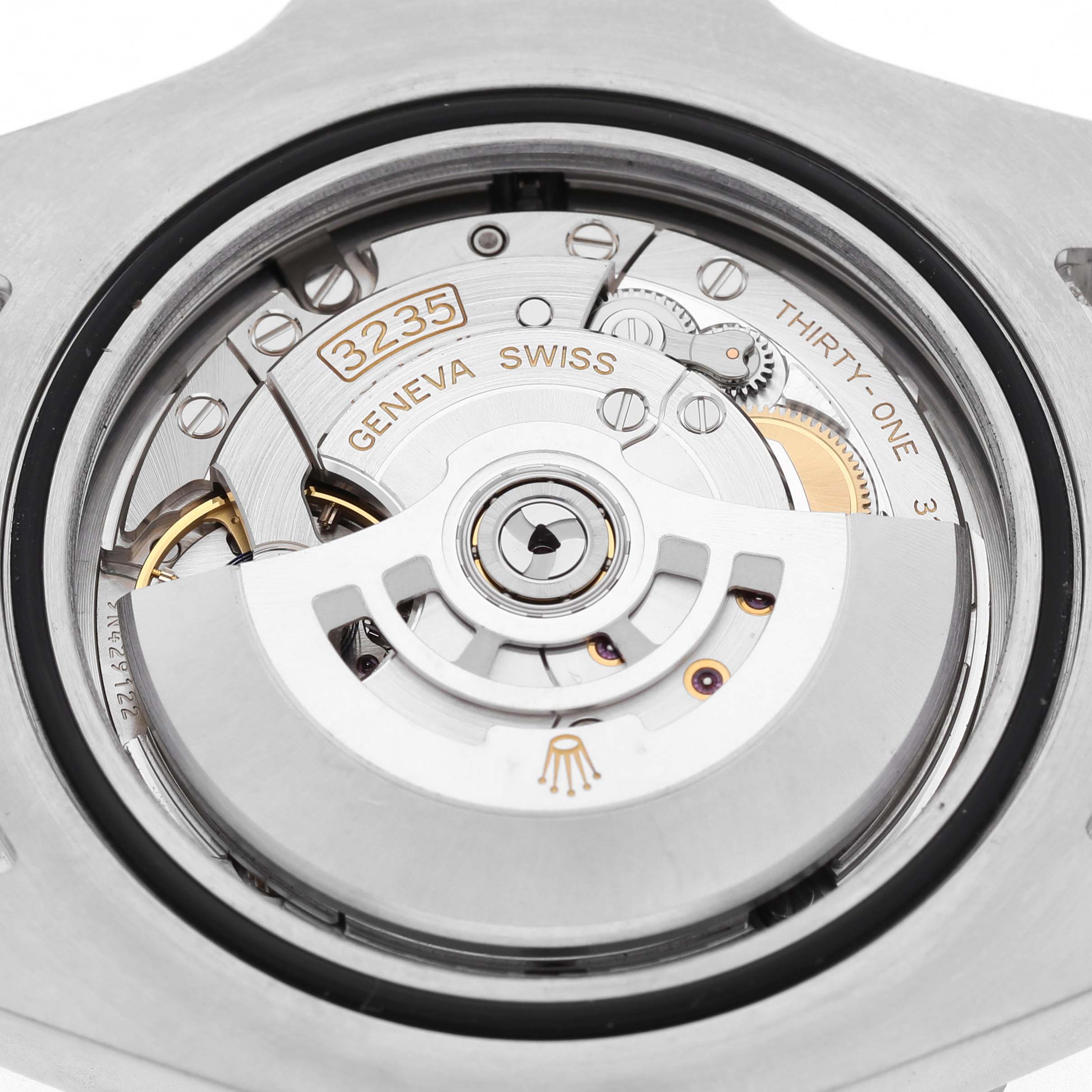 The image shows the movement of a Rolex Sea-Dweller 126600 Men's Stainless Steel Black Dial, highlighting the rotor and intricate mechanics from the back.