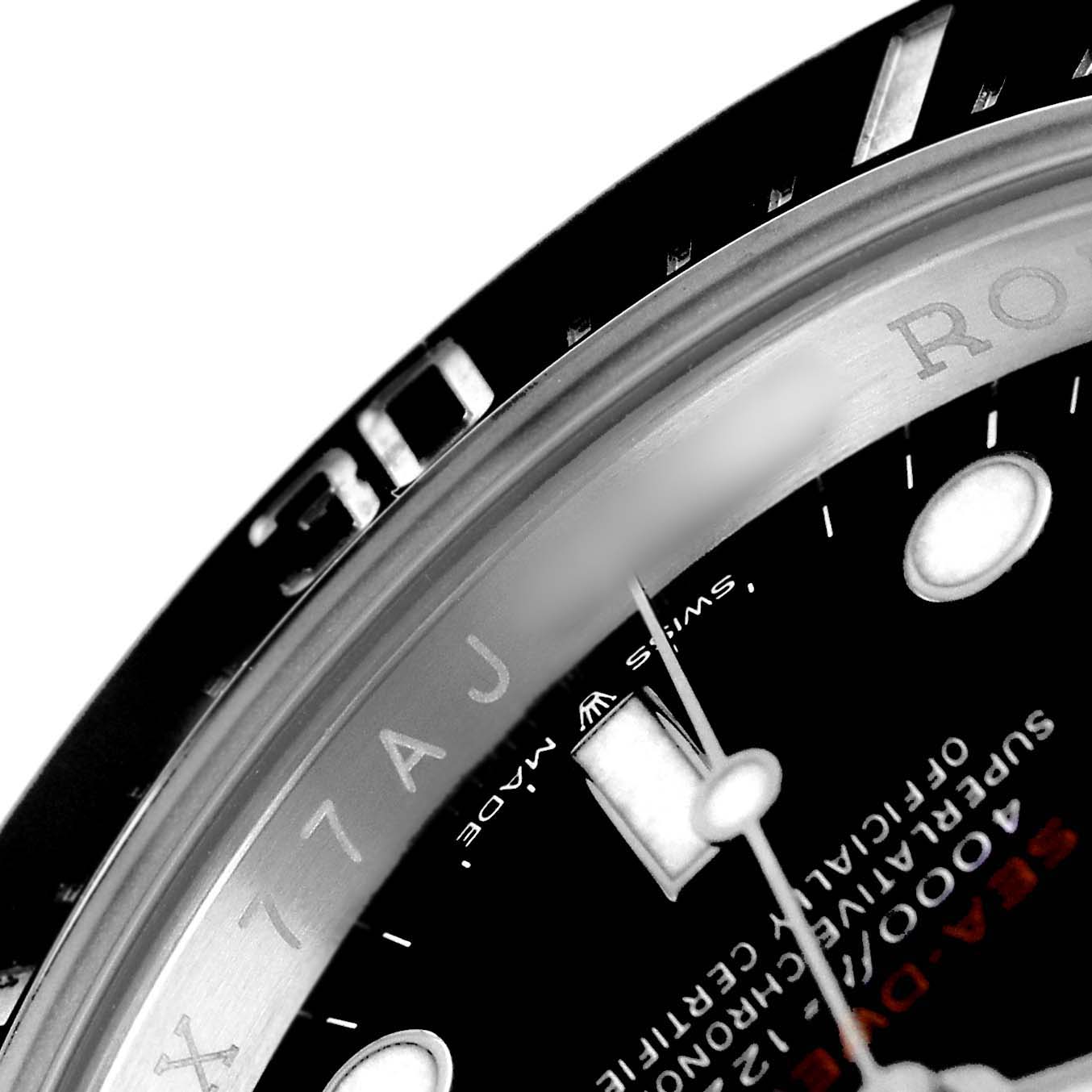 The image shows a close-up angle of the Rolex Sea-Dweller 126600 Men's Stainless Steel Black Dial's bezel, dial, and part of the hands.
