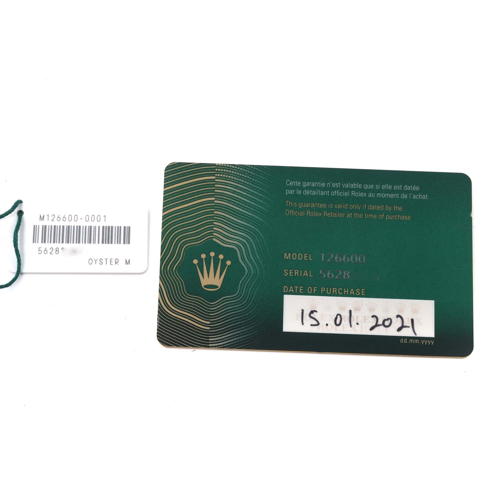 This image shows the warranty card and tag for the Rolex Sea-Dweller 126600 Men
s Stainless Steel Black Dial 126600 Men
s Stainless Steel Black Dial model 126600.
