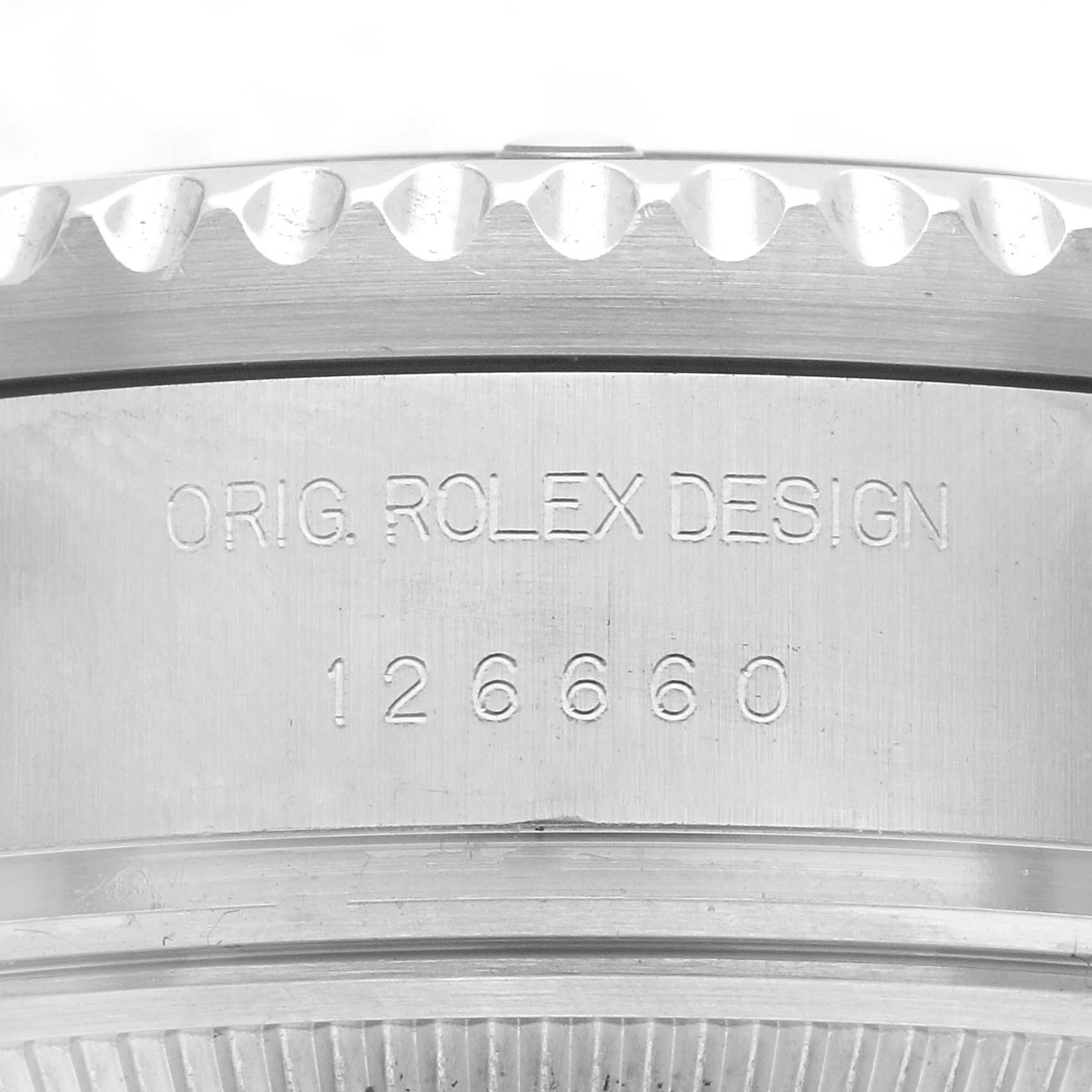 The image shows the side engraving of the Rolex Sea-Dweller 126660 Men
s Stainless Steel Blue Dial 126660 Men
s Stainless Steel Blue Dial model, featuring "ORIG. ROLEX DESIGN" and the model number "126660".