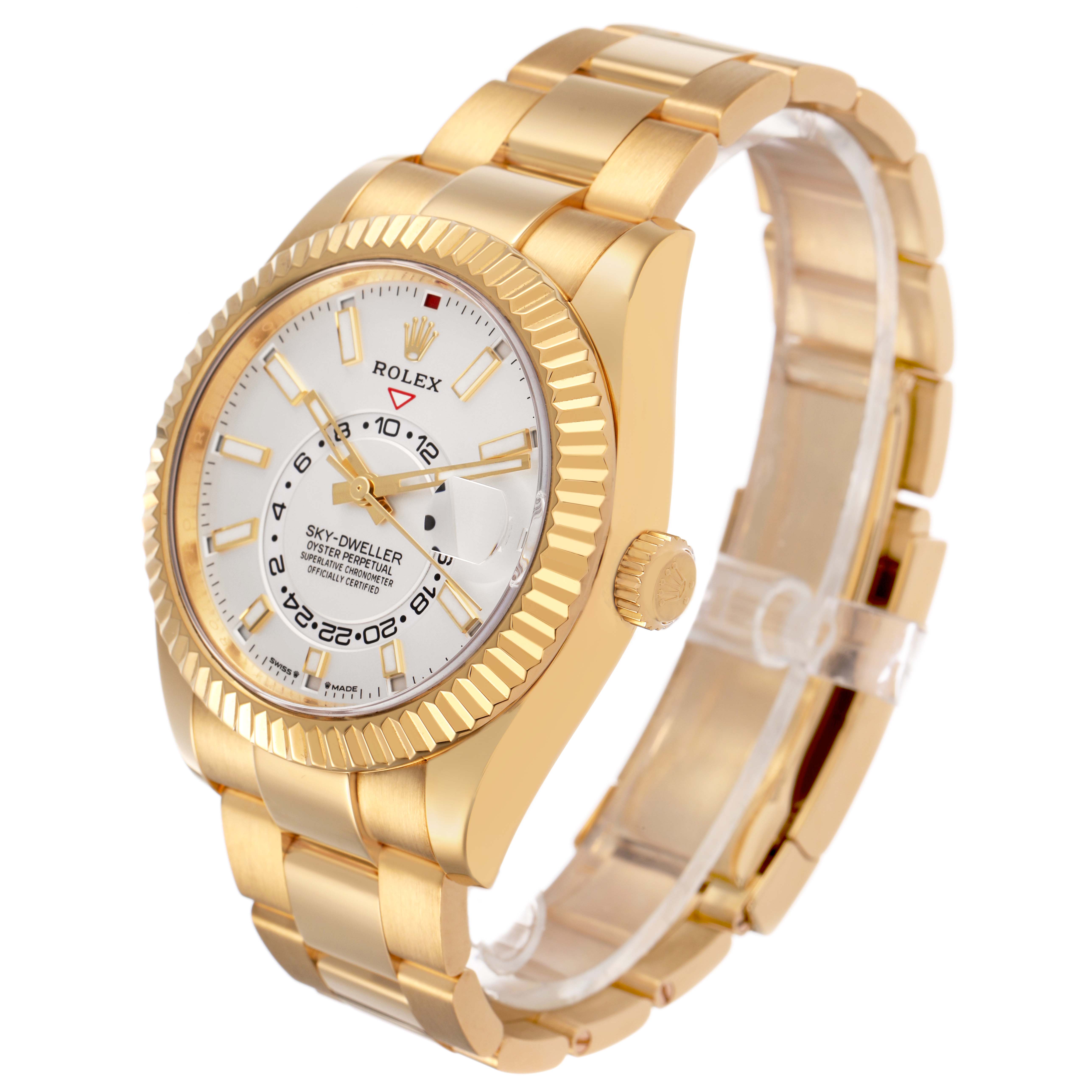 The Rolex Sky-Dweller 336938 Men's Yellow Gold White Dial watch is shown at a three-quarter angle, highlighting the dial, bezel, and bracelet.