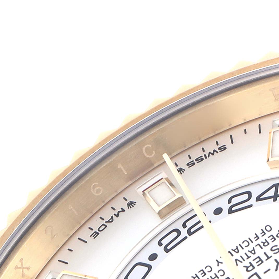 The image shows a close-up of the Rolex Sky-Dweller 336238 Men
s Yellow Gold Silver Dial 336238 Men
s Yellow Gold Silver Dial dial edge, focusing on the bezel and time indicators.