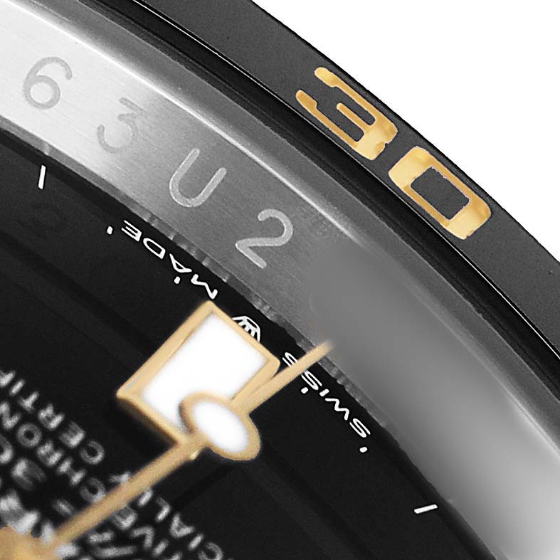 The image shows a close-up of the bezel and part of the dial of a Rolex Submariner 126613 Men's Steel and Gold (two tone) Black Dial, highlighting the "30" marker.