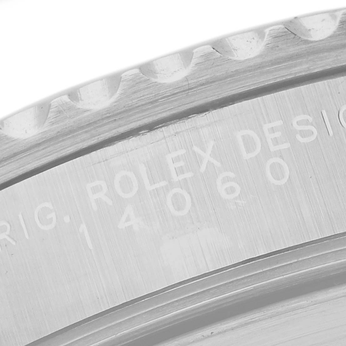 This image shows a close-up angle of the bezel and engraved serial number on a Rolex Submariner 14060 Men
s Stainless Steel Black Dial 14060 Men
s Stainless Steel Black Dial model.