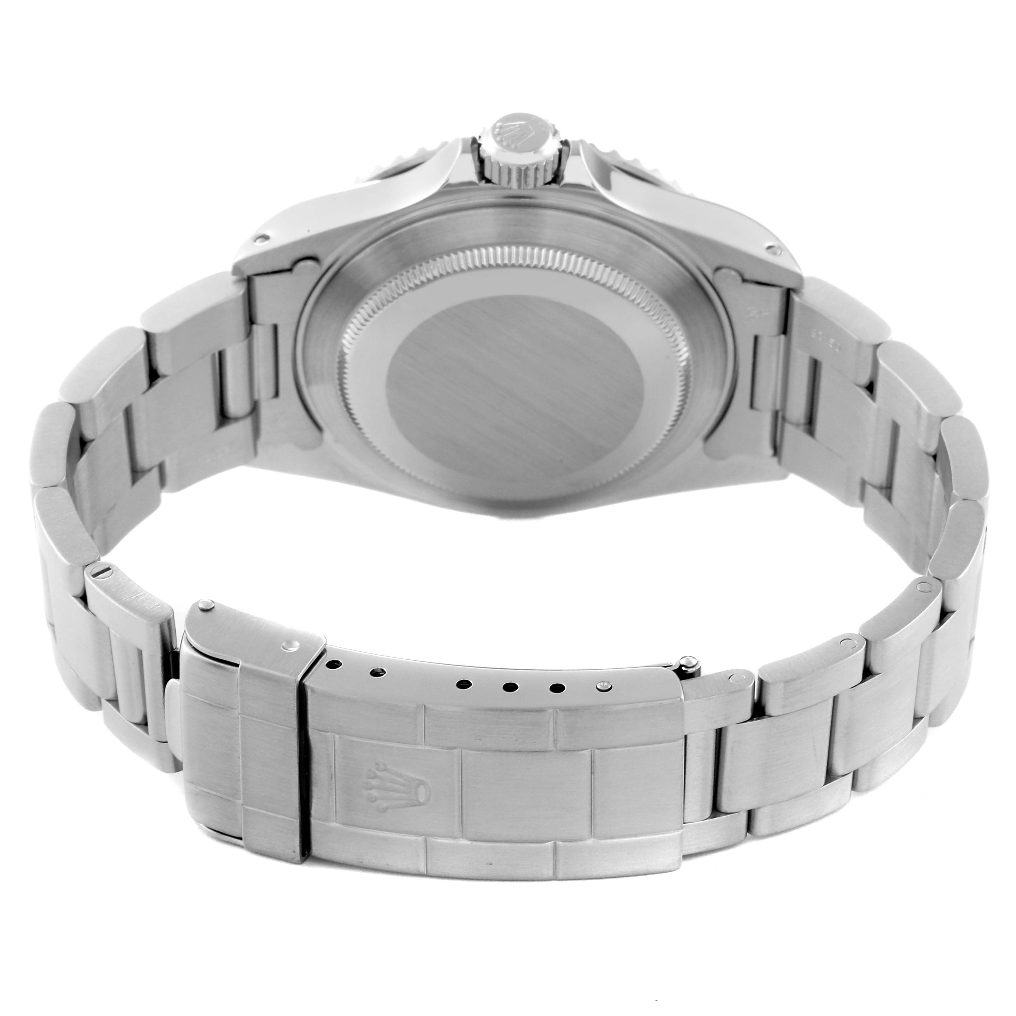 This image shows the back view of a Rolex Submariner 14060 Men
s Stainless Steel Black Dial 14060 Men
s Stainless Steel Black Dial watch, highlighting the case back and bracelet with the clasp.