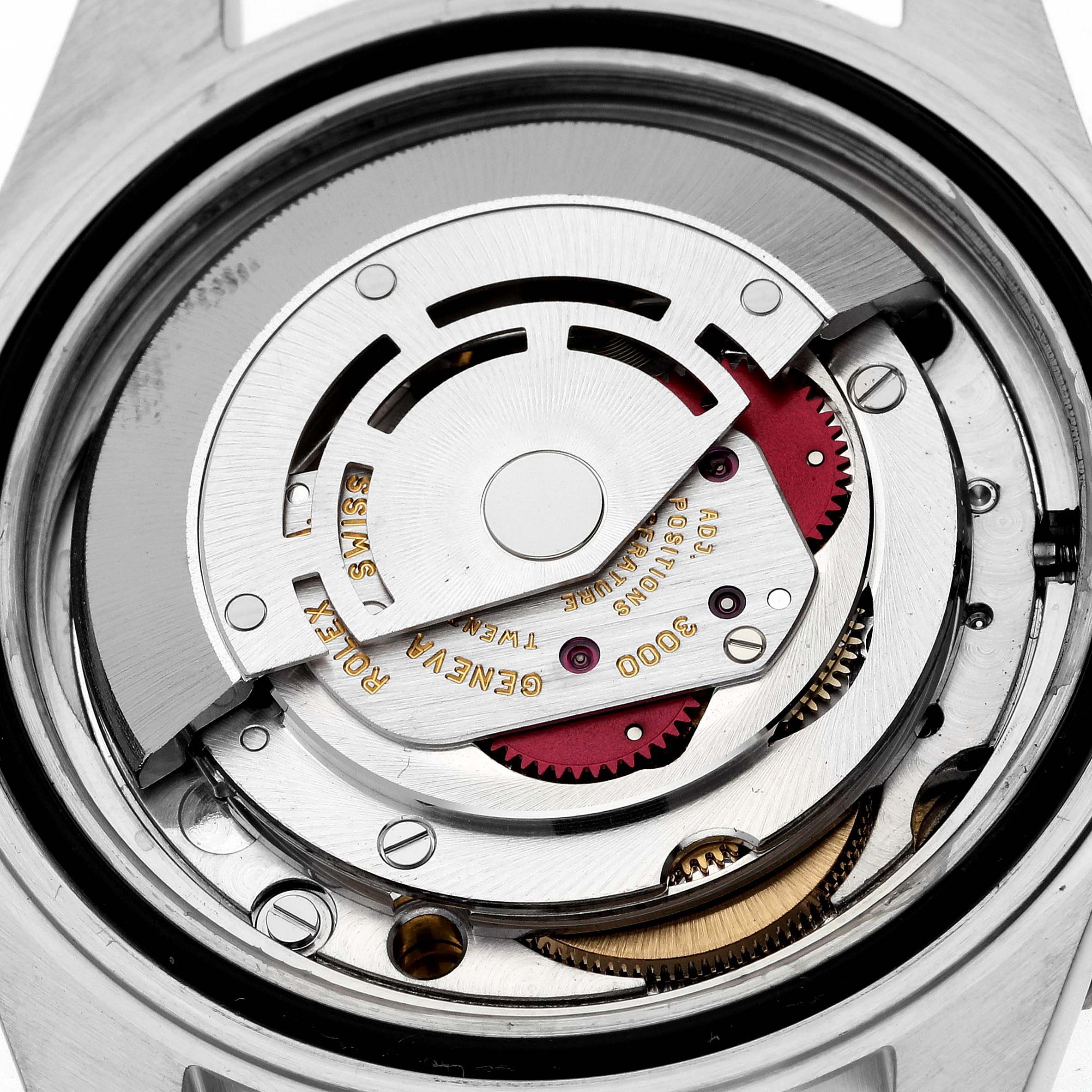 The image shows a close-up view of the movement inside a Rolex Submariner 14060 Men
s Stainless Steel Black Dial 14060 Men
s Stainless Steel Black Dial, highlighting the intricate mechanical components.