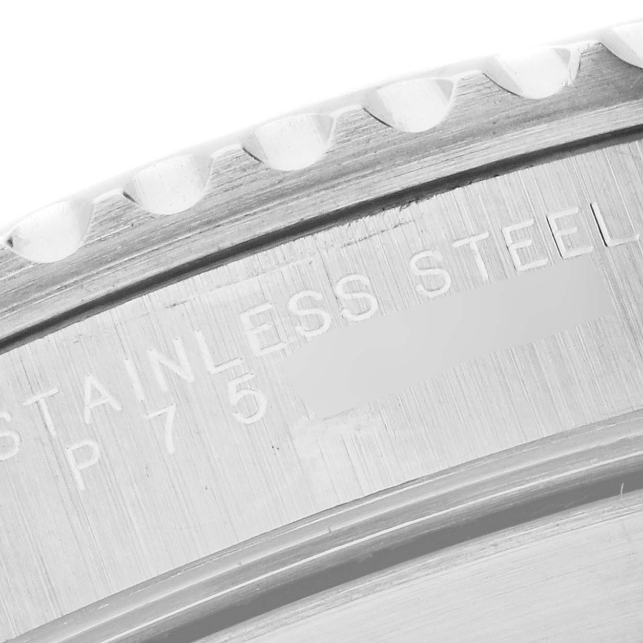 This close-up image shows the engraved text on the case side of a Rolex Submariner 14060 Men
s Stainless Steel Black Dial 14060 Men
s Stainless Steel Black Dial watch in stainless steel.