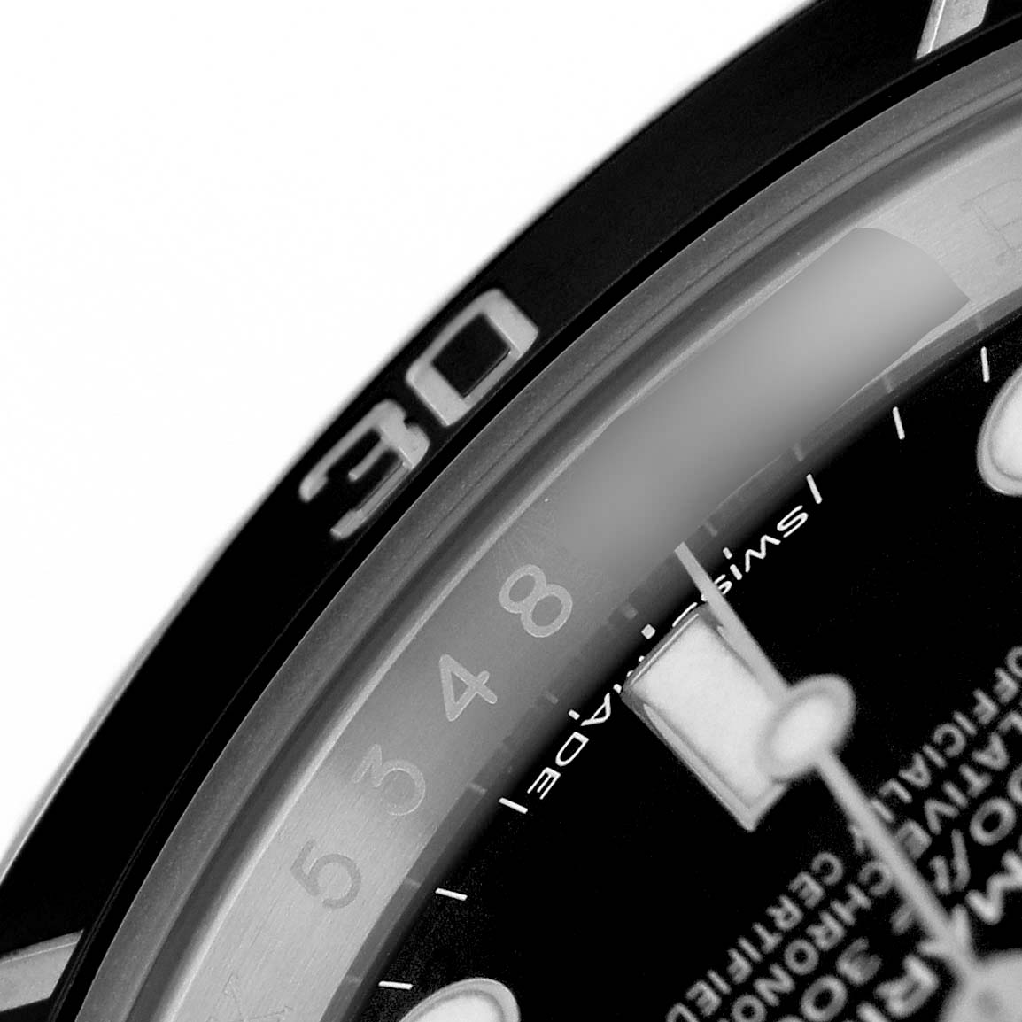 The image shows a close-up angle of the Rolex Submariner 114060 Men's Stainless Steel Black Dial's bezel, partial dial, and minute markers.