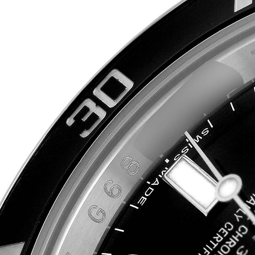 The image shows a close-up of the Rolex Submariner 114060 Men's Stainless Steel Black Dial's bezel and part of the dial, angled to highlight the "30" minute mark.