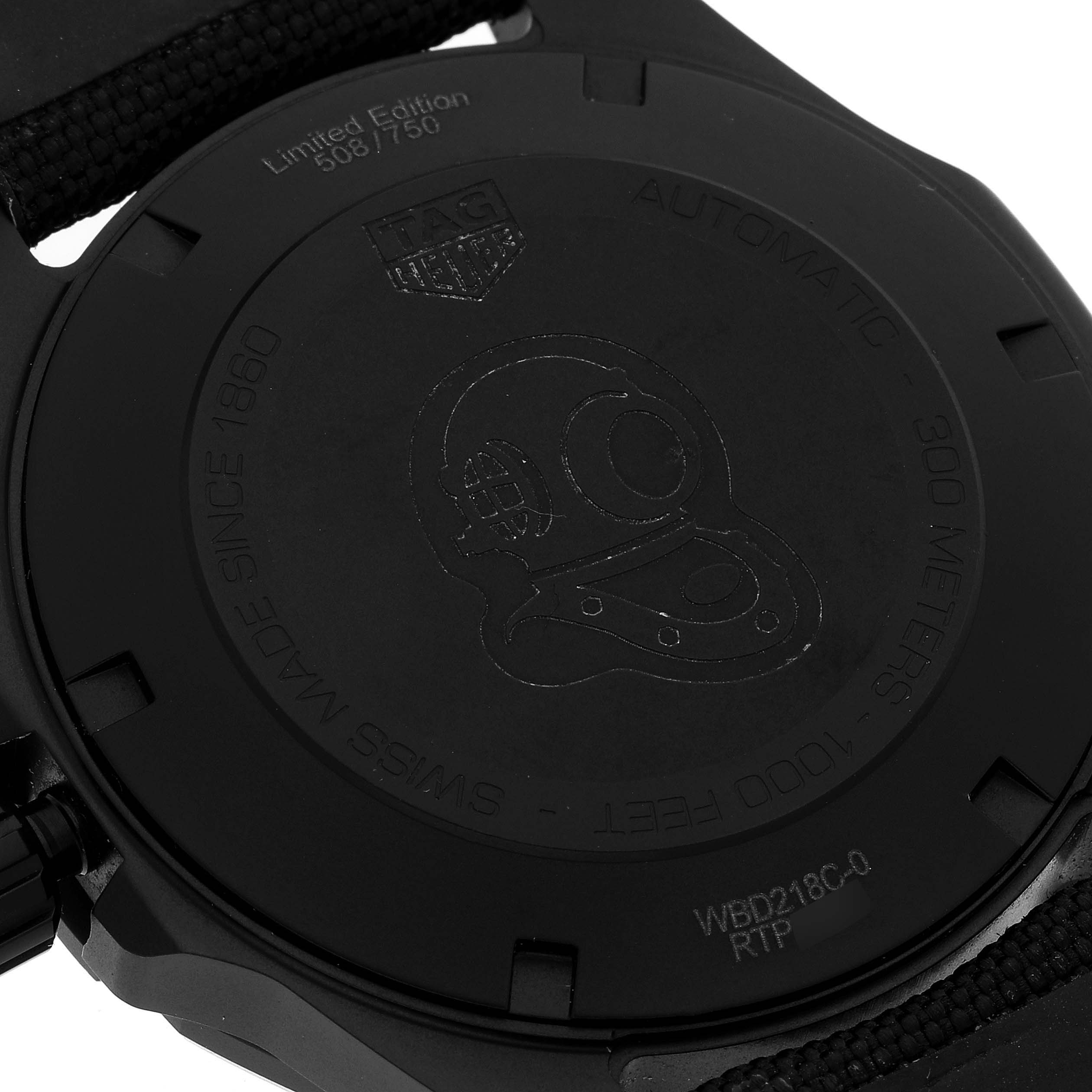 This image shows the back of the Tag Heuer Aquaracer watch featuring its engraved details and strap attachment.