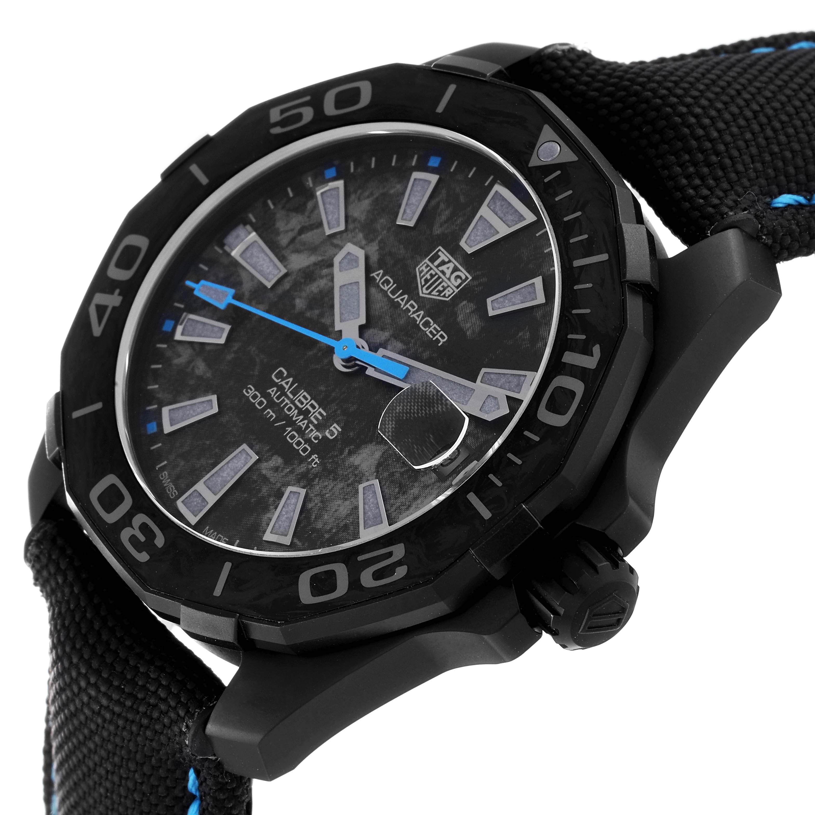 The image shows a side-angle view of a Tag Heuer Aquaracer watch, highlighting the dial, bezel, hour markers, hands, and strap.