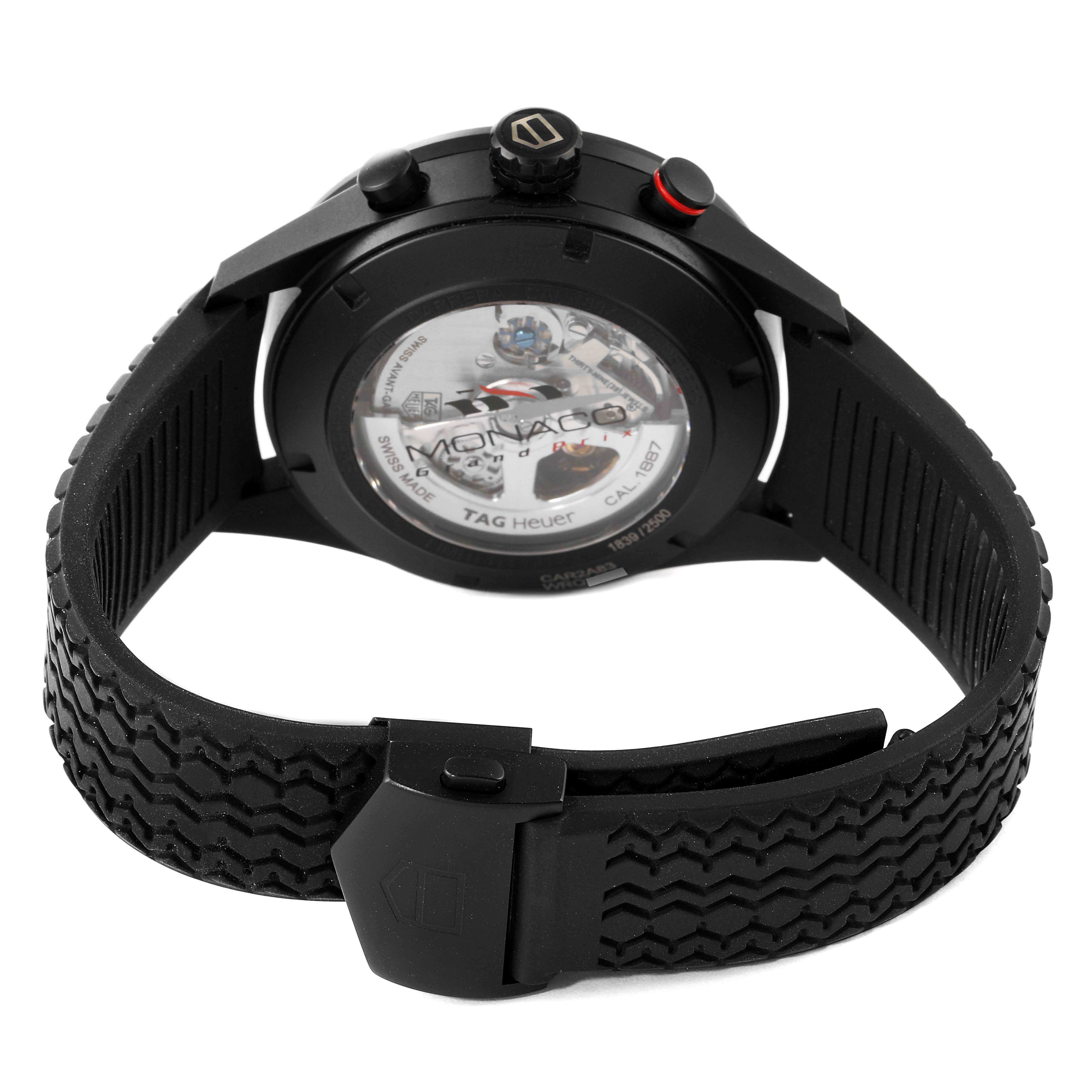 The image shows the back view of a Tag Heuer Monaco CAR2A83.FT6033 Men's Titanium Black Dial CAR2A83.FT6033 Men's Titanium Black Dial watch, highlighting the transparent case back and strap.