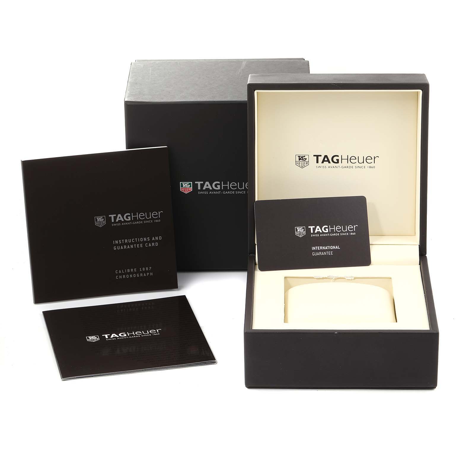 The image shows a Tag Heuer Monaco CAR2A83.FT6033 Men's Titanium Black Dial CAR2A83.FT6033 Men's Titanium Black Dial watch box, instruction manual, guarantee card, and outer packaging from a front angle.