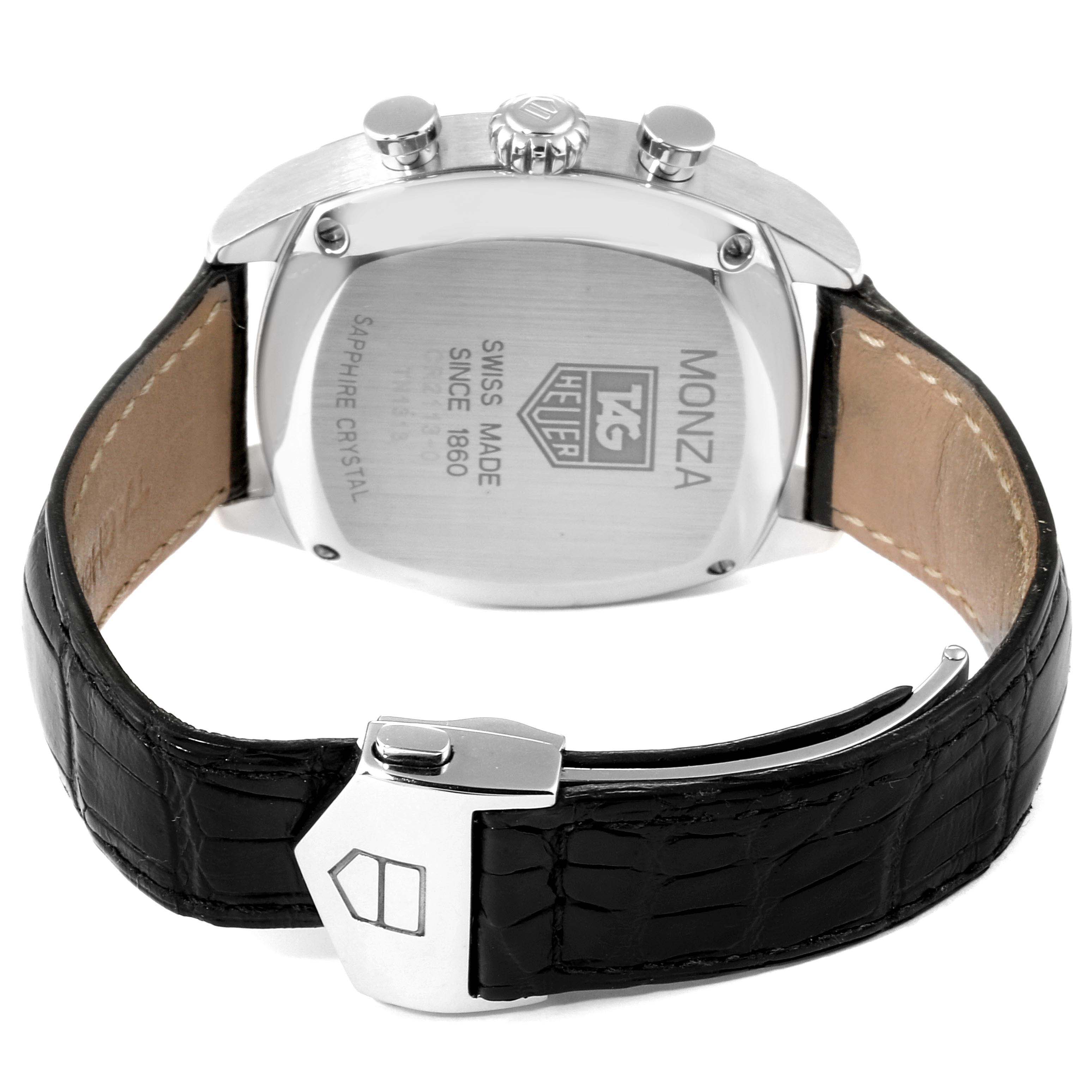 The image shows the back view of the Tag Heuer Monza CR2113.FC6164 Men's Stainless Steel Black Dial CR2113.FC6164 Men's Stainless Steel Black Dial watch, highlighting its stainless steel case, black leather strap, and clasp.