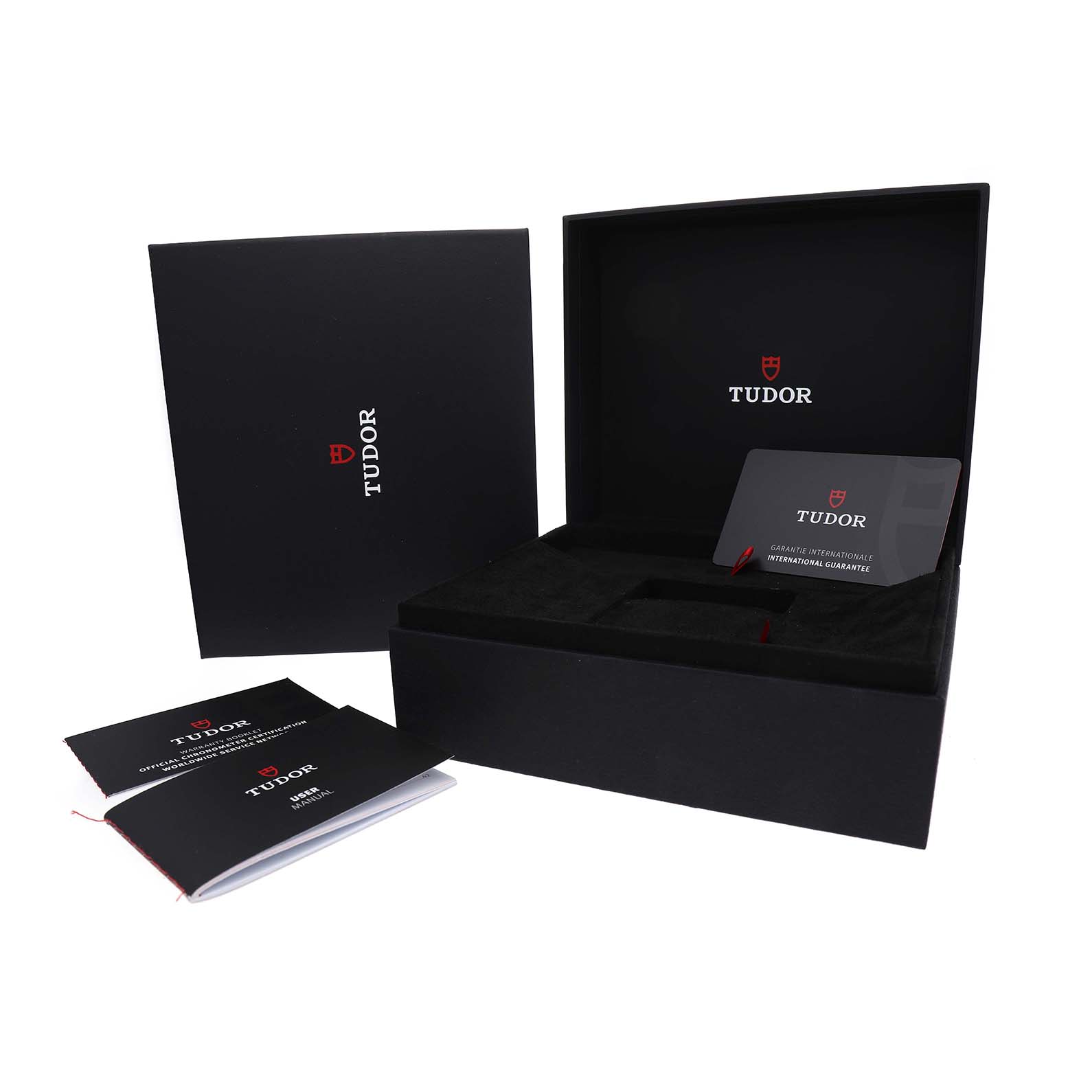 The Tudor Heritage Chrono 79360B Men's Stainless Steel Blue Dial packaging includes a black box, warranty card, and booklets shown from a frontal angle.