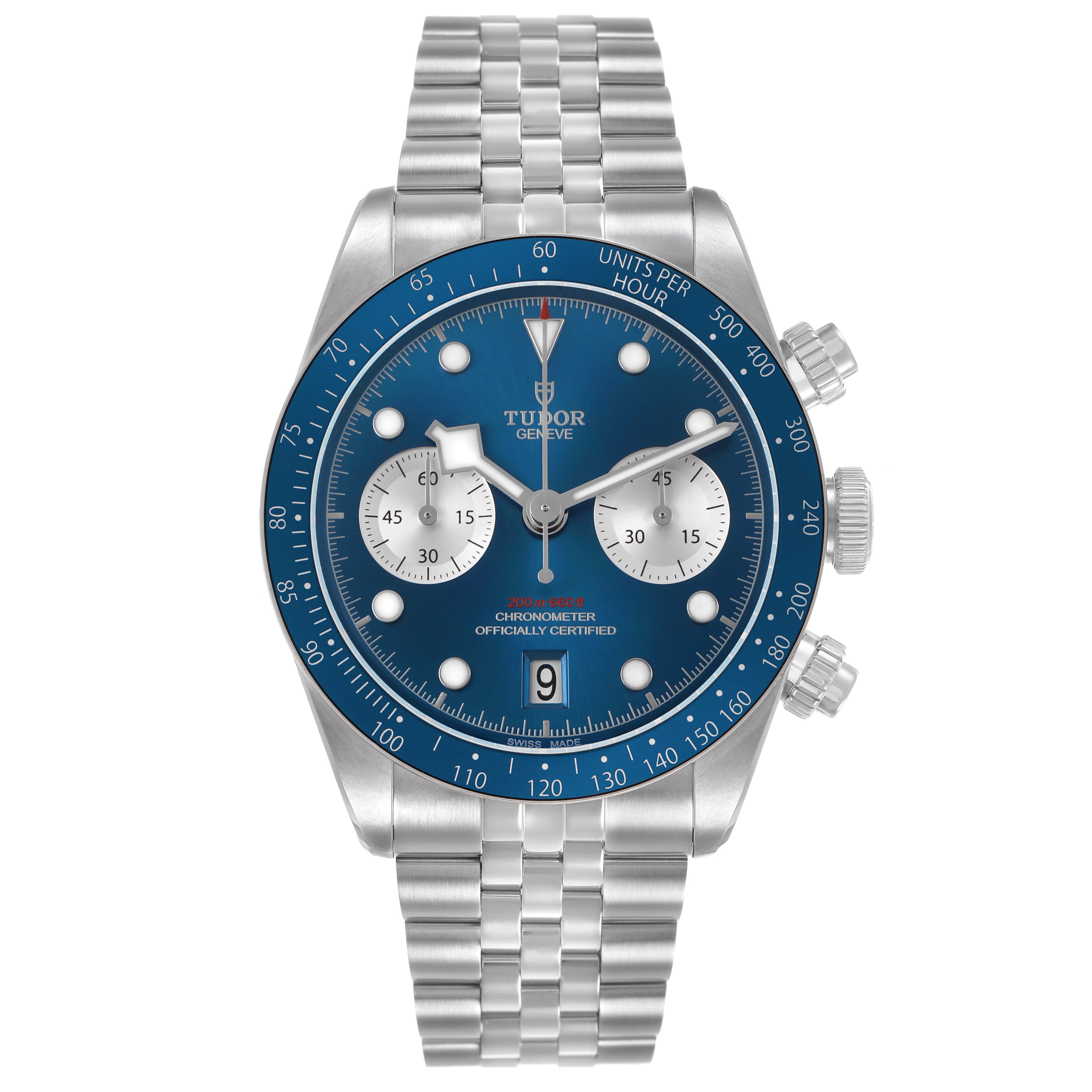 The Tudor Heritage Chrono 79360B Men's Stainless Steel Blue Dial watch is shown from a front angle, displaying its blue dial, bezel, chronograph subdials, and stainless steel bracelet.