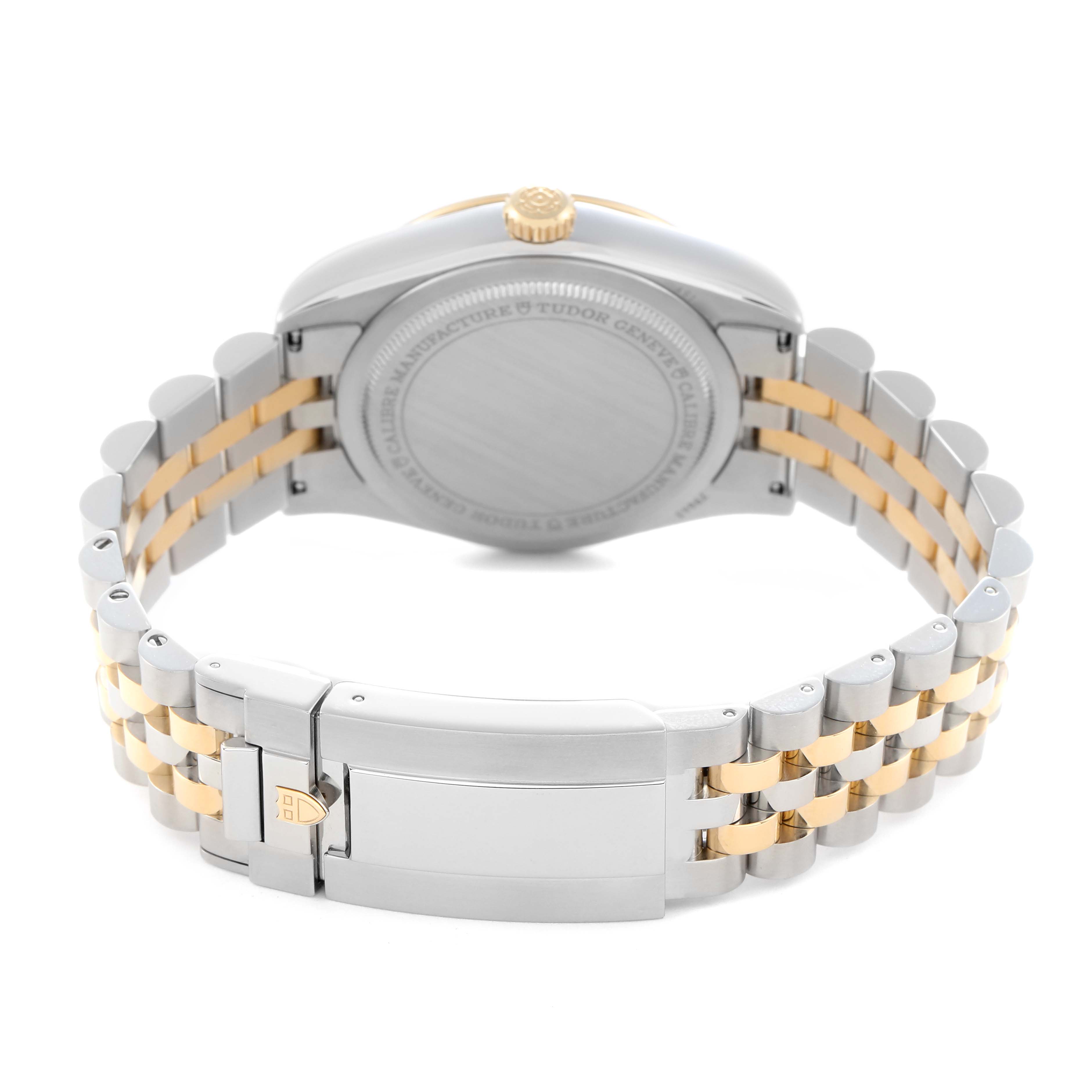 The image shows the back case and bracelet of the Tudor Heritage Black Bay M79643-0005 Men
s Steel and Gold (two tone) Champagne Dial M79643-0005 Men
s Steel and Gold (two tone) Champagne Dial watch, highlighting its clasp and two-tone design.