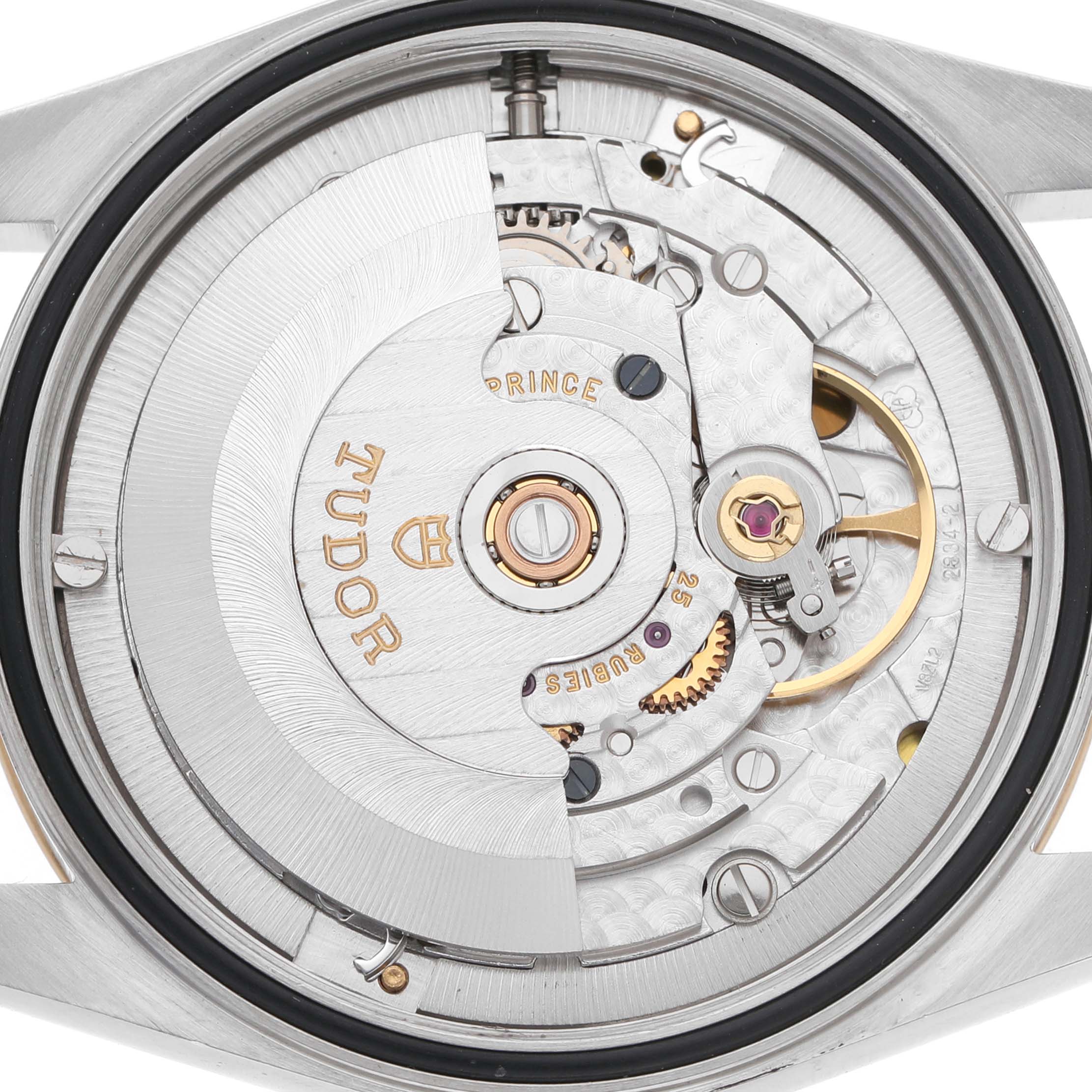 The image shows a close-up of the movement of a Tudor Prince 76213 Men's Stainless Steel Champagne Dial watch, highlighting its intricate mechanical parts.