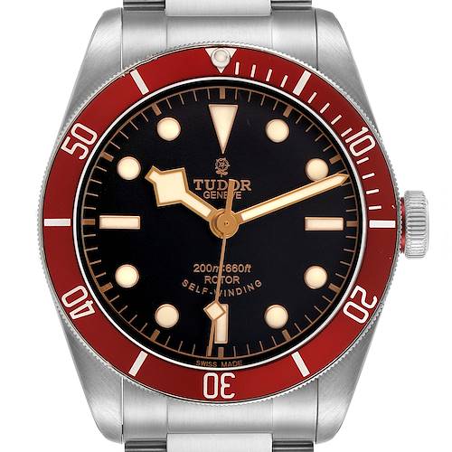 The image shows a frontal view of the Tudor Heritage Black Bay 79220R Men's Stainless Steel Black Dial watch, highlighting its red bezel, black dial, and luminous markers.