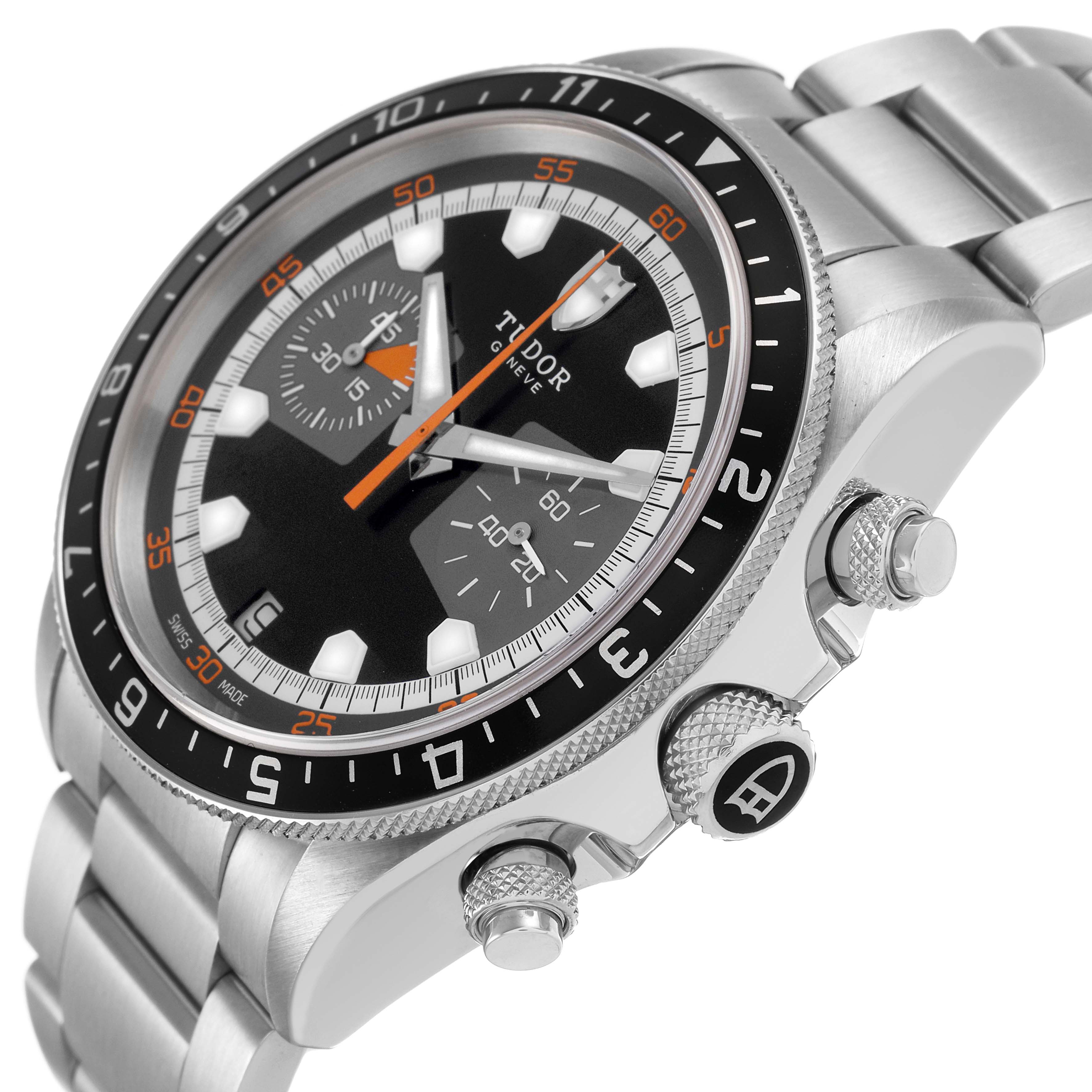 The Tudor Heritage Chrono 70330N Men's Stainless Steel Black Dial watch is shown at an angle highlighting the face, bezel, and side pushers.