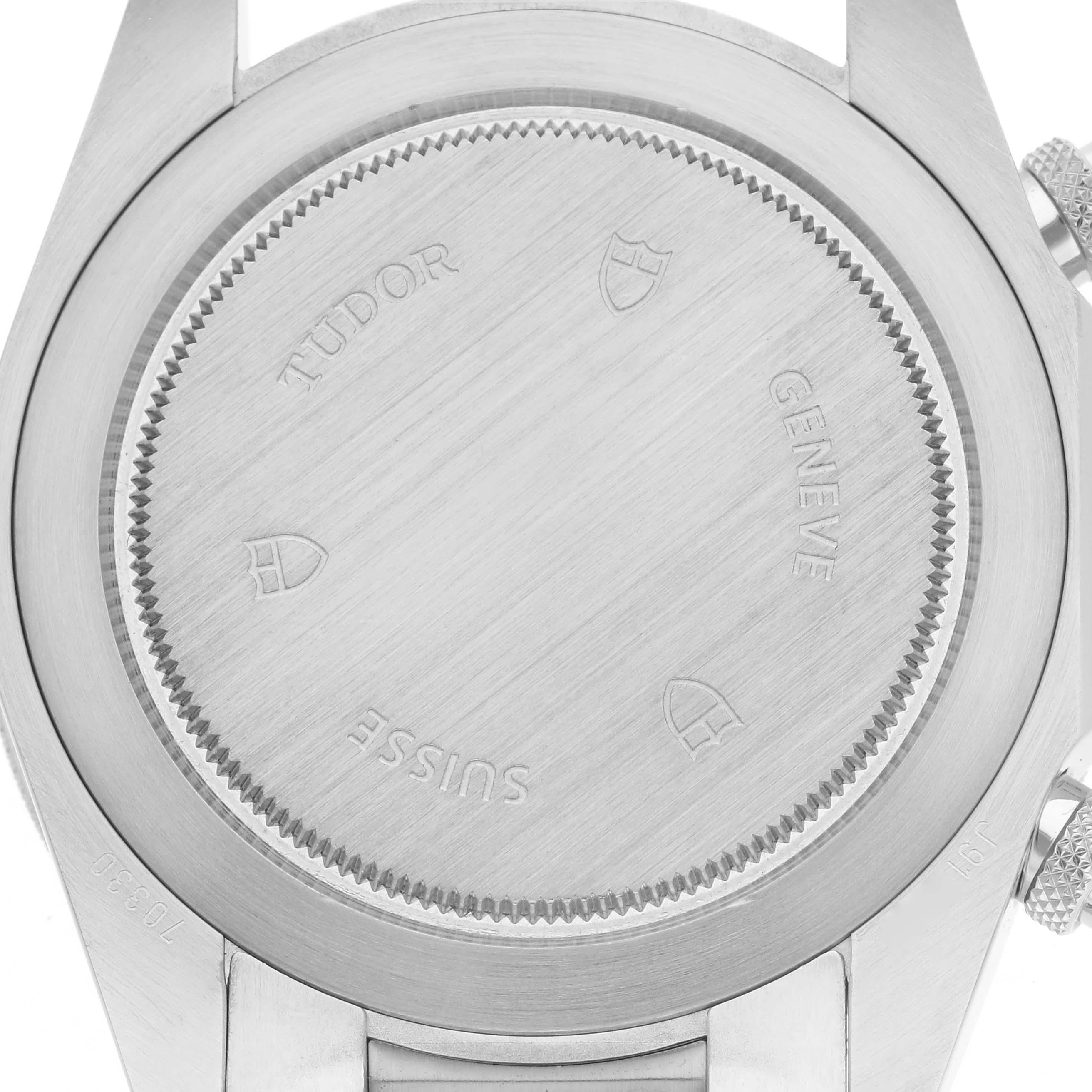 The image shows the back case of a Tudor Heritage Chrono 70330N-65740 Men
s Stainless Steel Grey Dial 70330N-65740 Men
s Stainless Steel Grey Dial watch, highlighting the engraved branding and markings.