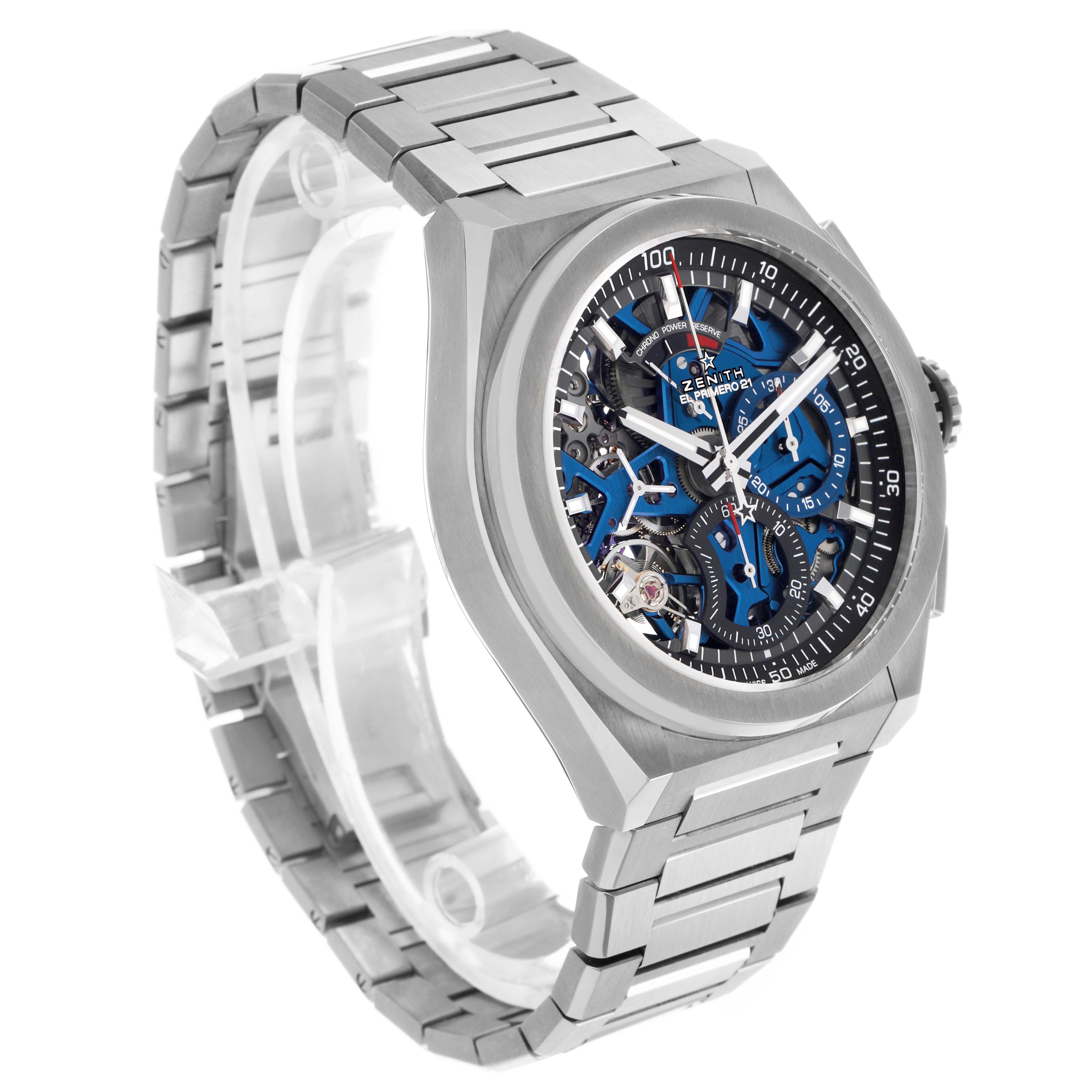 The Zenith El Primero 95.9002.9004/78.M9000 Men's Titanium Blue Dial watch is shown at a three-quarter angle, highlighting its face, case, and bracelet.