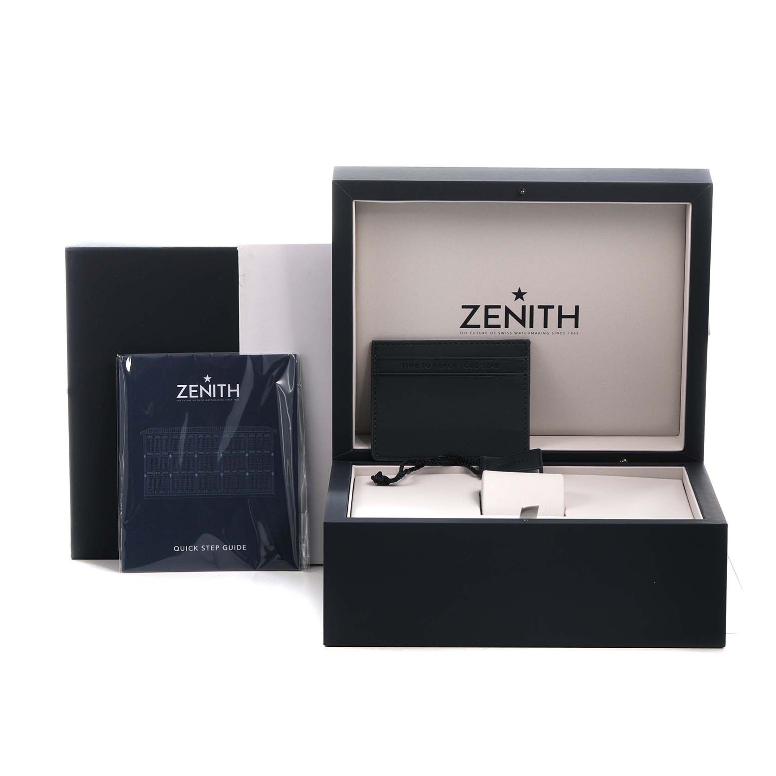 The image shows a Zenith El Primero 95.9002.9004/78.M9000 Men's Titanium Blue Dial watch box, manual, and cardholder from a front angle.