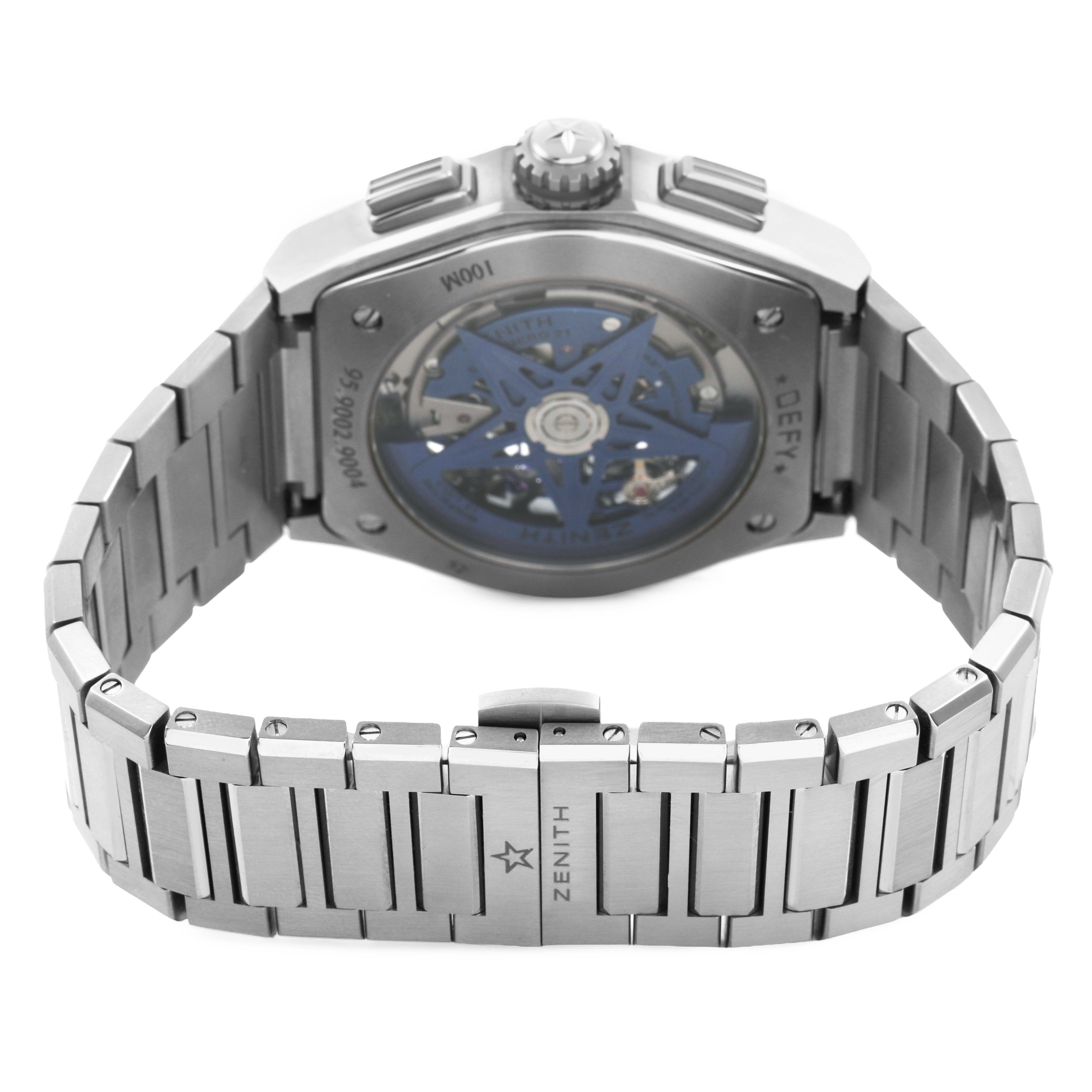 The Zenith El Primero 95.9002.9004/78.M9000 Men's Titanium Blue Dial watch is shown from a rear angle, displaying the back case, visible movement, crown, pushers, and bracelet.
