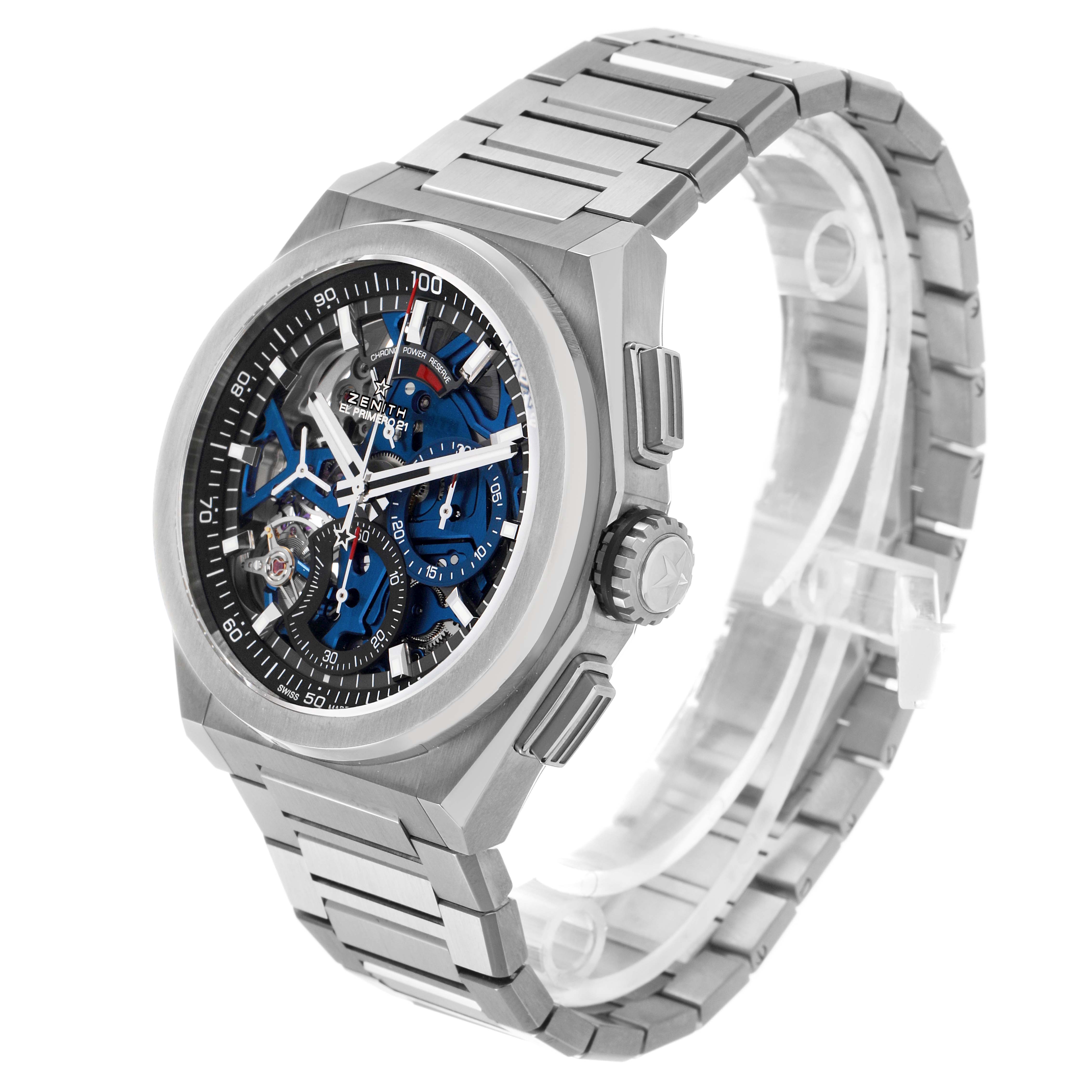 The image shows a Zenith El Primero 95.9002.9004/78.M9000 Men's Titanium Blue Dial watch at a three-quarter angle, highlighting the case, dial, crown, and metal bracelet.