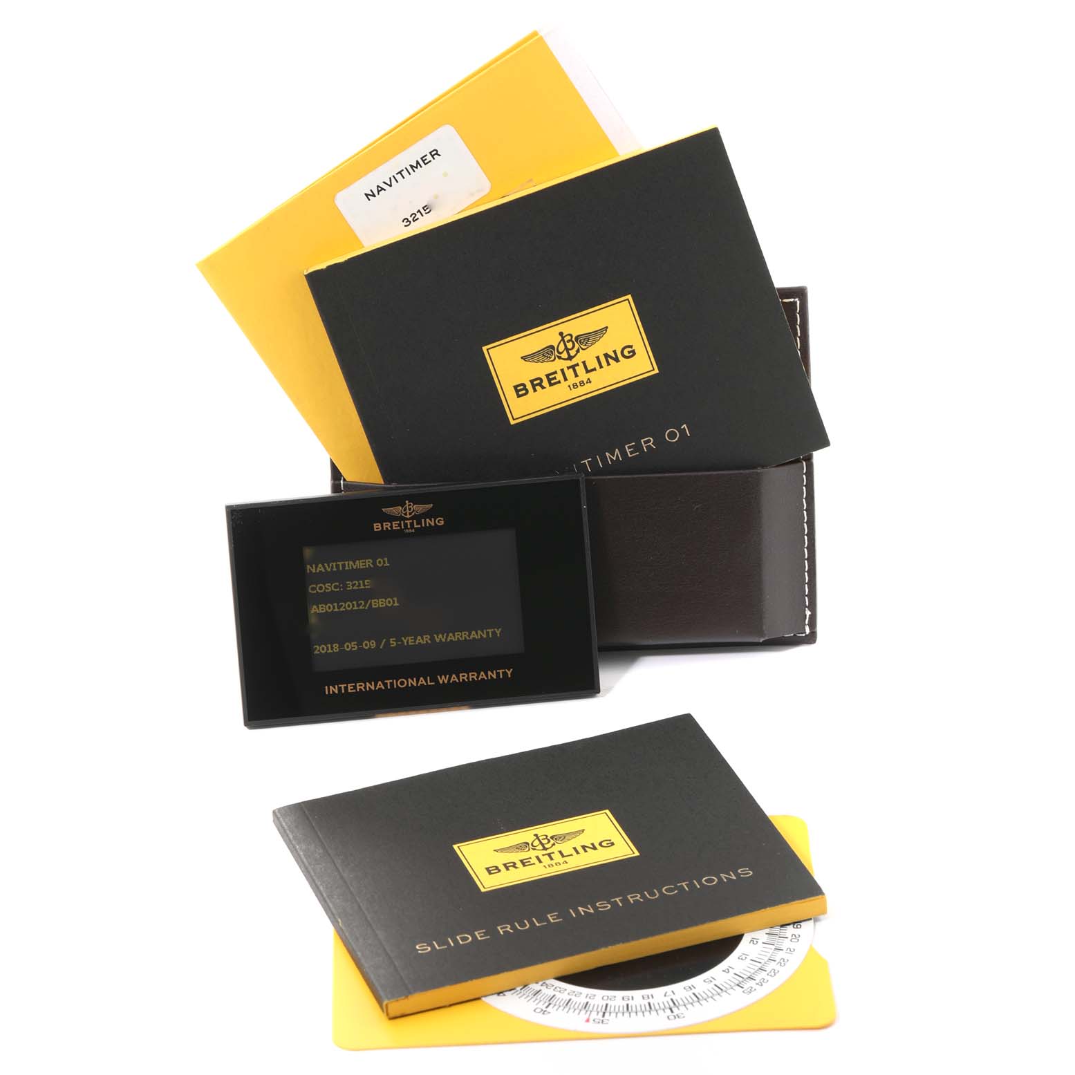 The image shows the instruction manuals, warranty card, and packaging materials for a Breitling Navitimer AB0120 Men
s Stainless Steel Black Dial AB0120 Men
s Stainless Steel Black Dial watch.