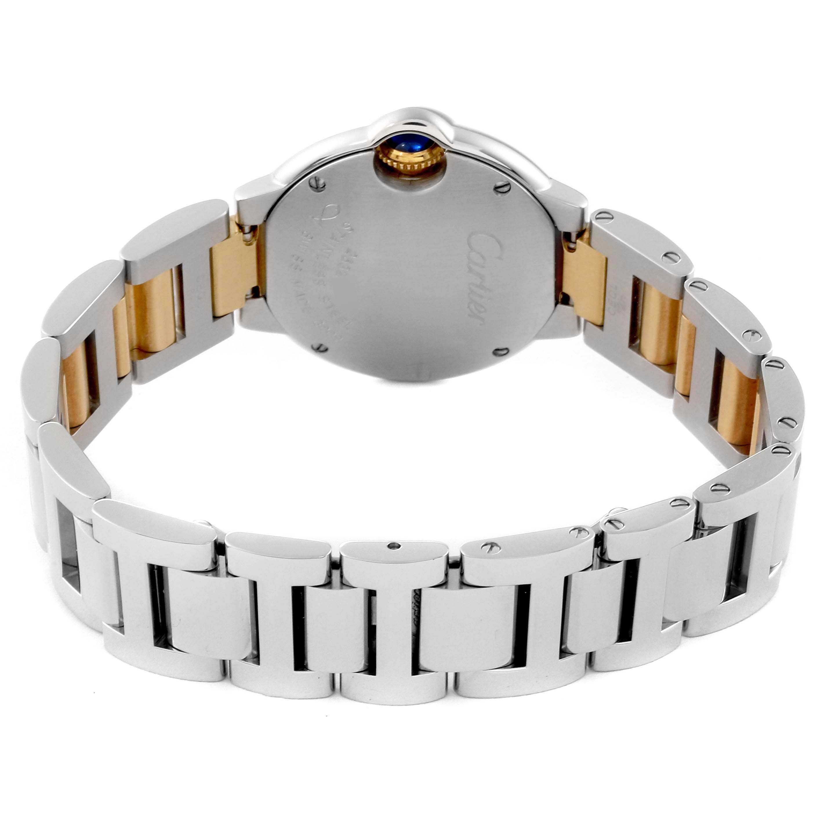 The image shows the back and bracelet of the Ballon Bleu model by Cartier, highlighting the dual-tone metal links and the crown.