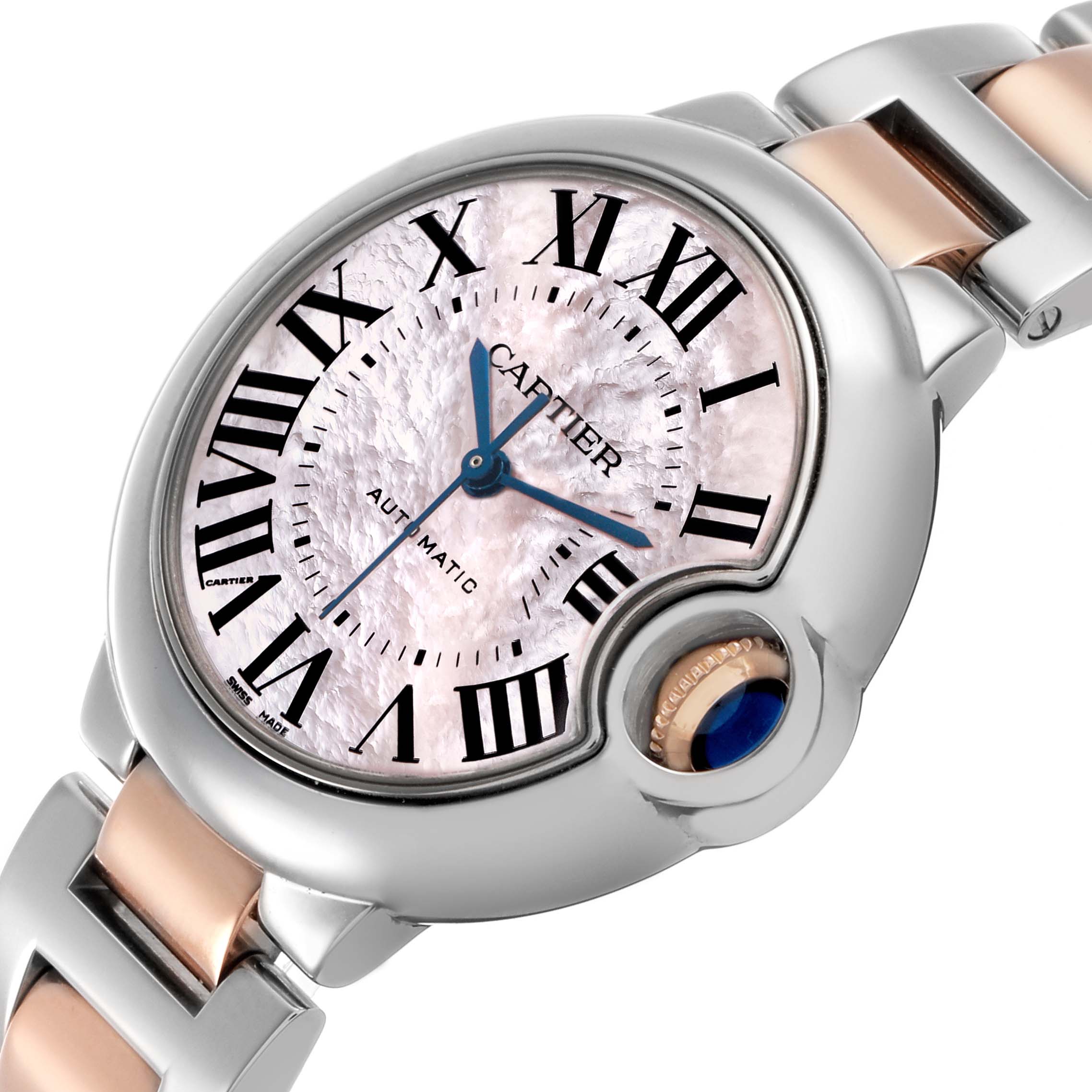 The Cartier Ballon Bleu W6920070 Women's Stainless Steel Pink Dial watch is shown at an angled close-up, highlighting the mother-of-pearl dial, Roman numerals, and cabochon crown.