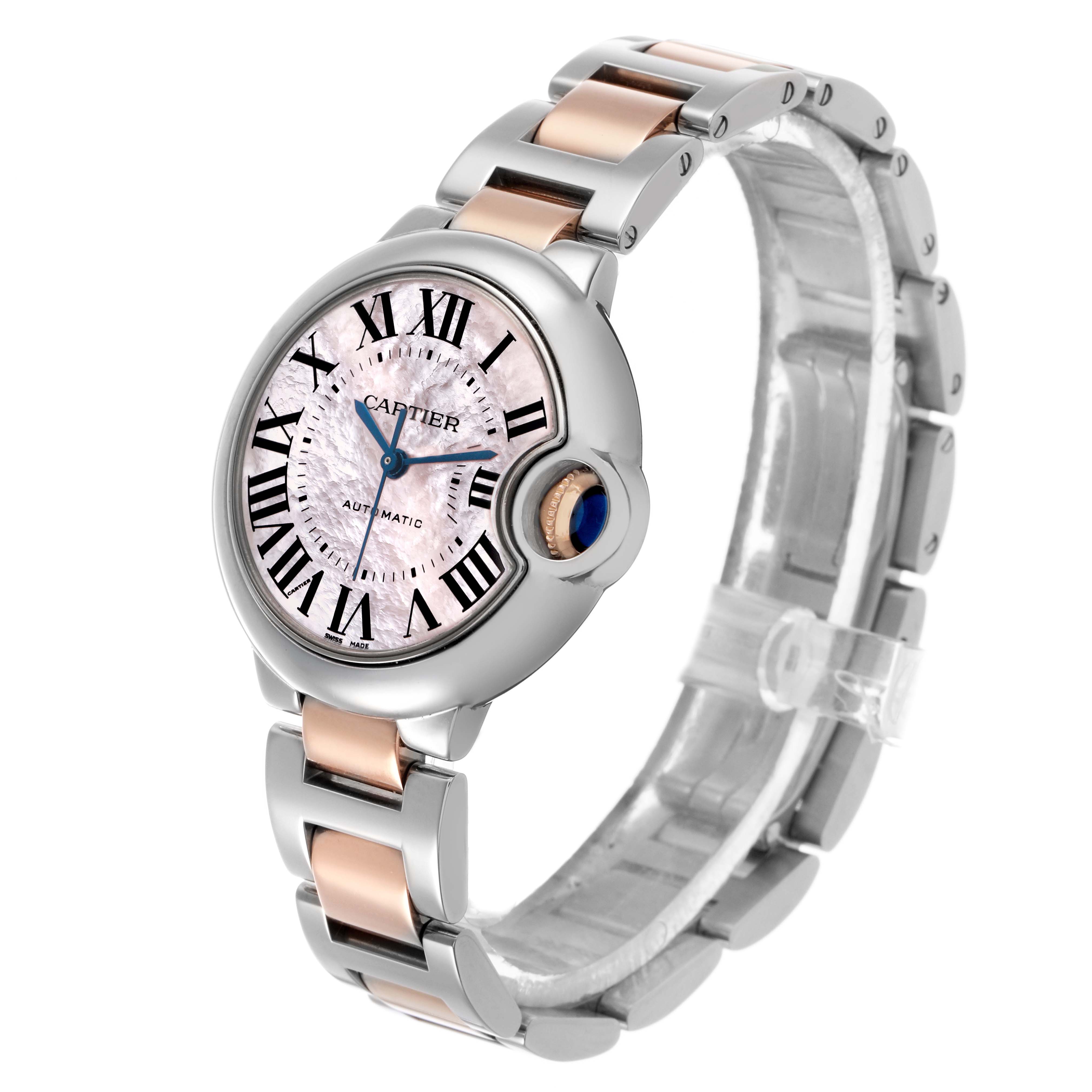 The Cartier Ballon Bleu W6920070 Women's Stainless Steel Pink Dial watch is shown from a three-quarter angle highlighting its face, crown, and two-tone bracelet.