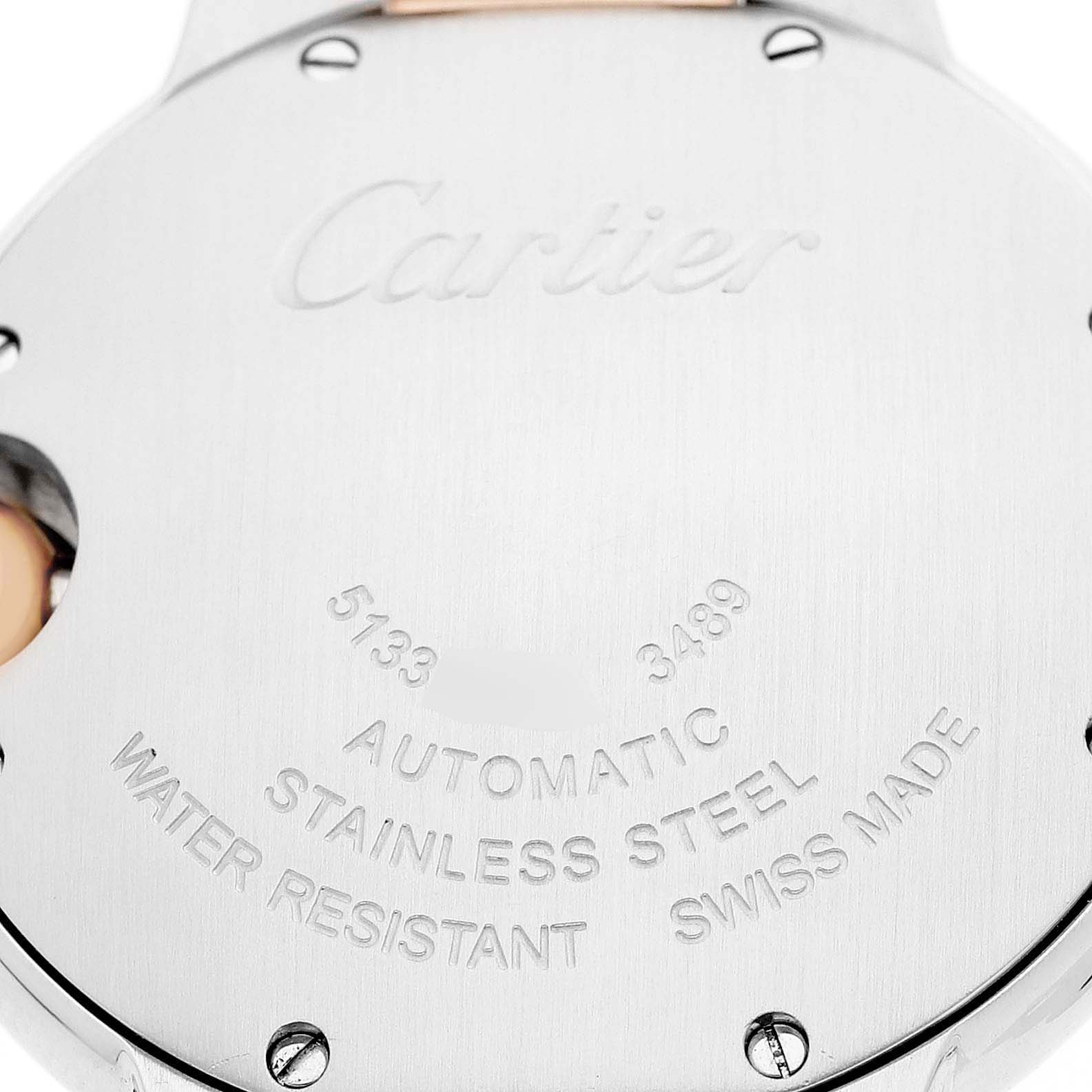 The image shows the back of a Cartier Ballon Bleu W6920070 Women's Stainless Steel Pink Dial watch, highlighting its engravings and stainless steel casing.